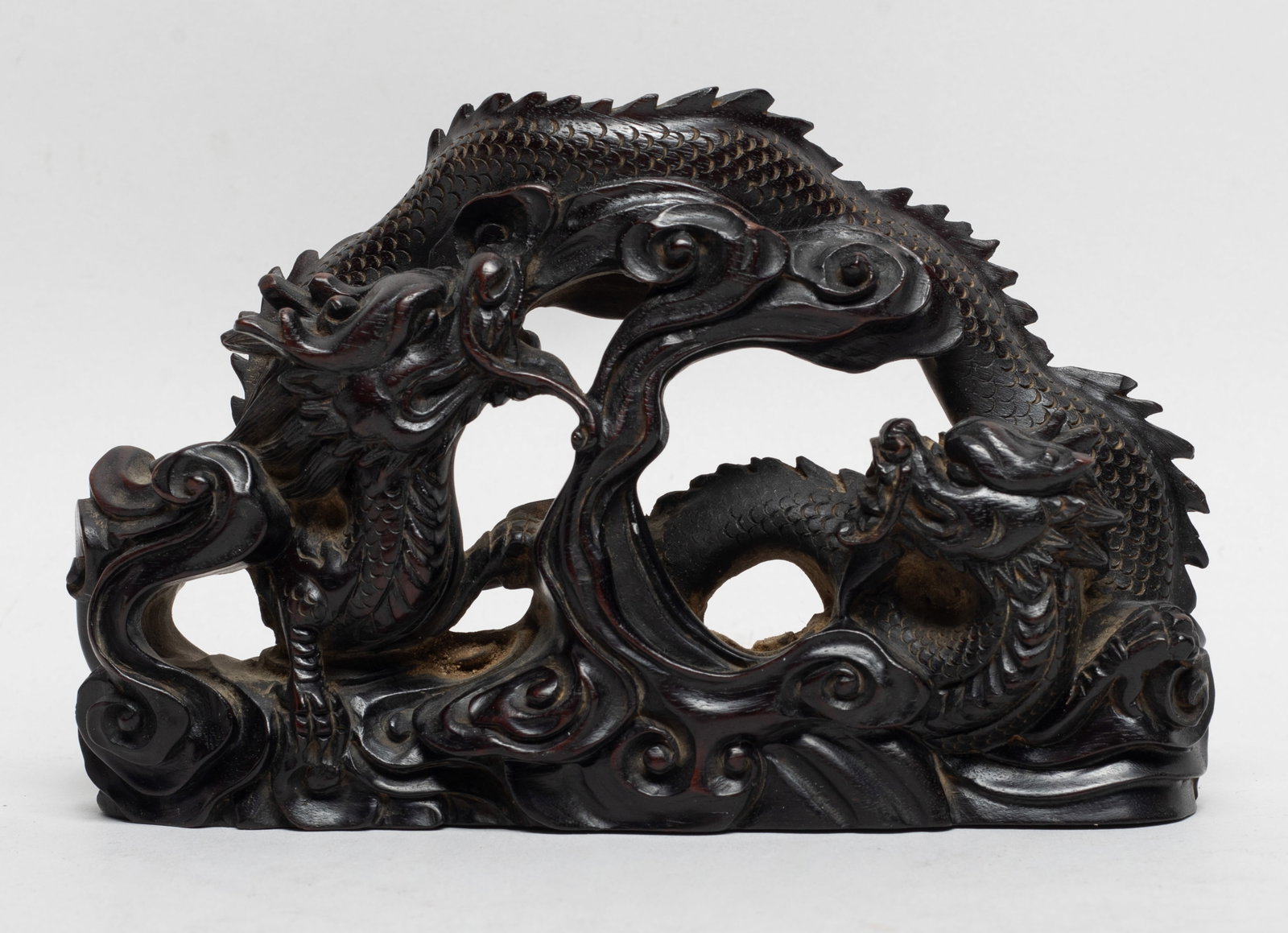 Rare Chinese Zitan Wood Dragon Brush Stand: Carved and reticulated as two sinuous dragons amidst scrolling clouds. Approx. 5.8*3.7*1.6 inch, 210 gram.