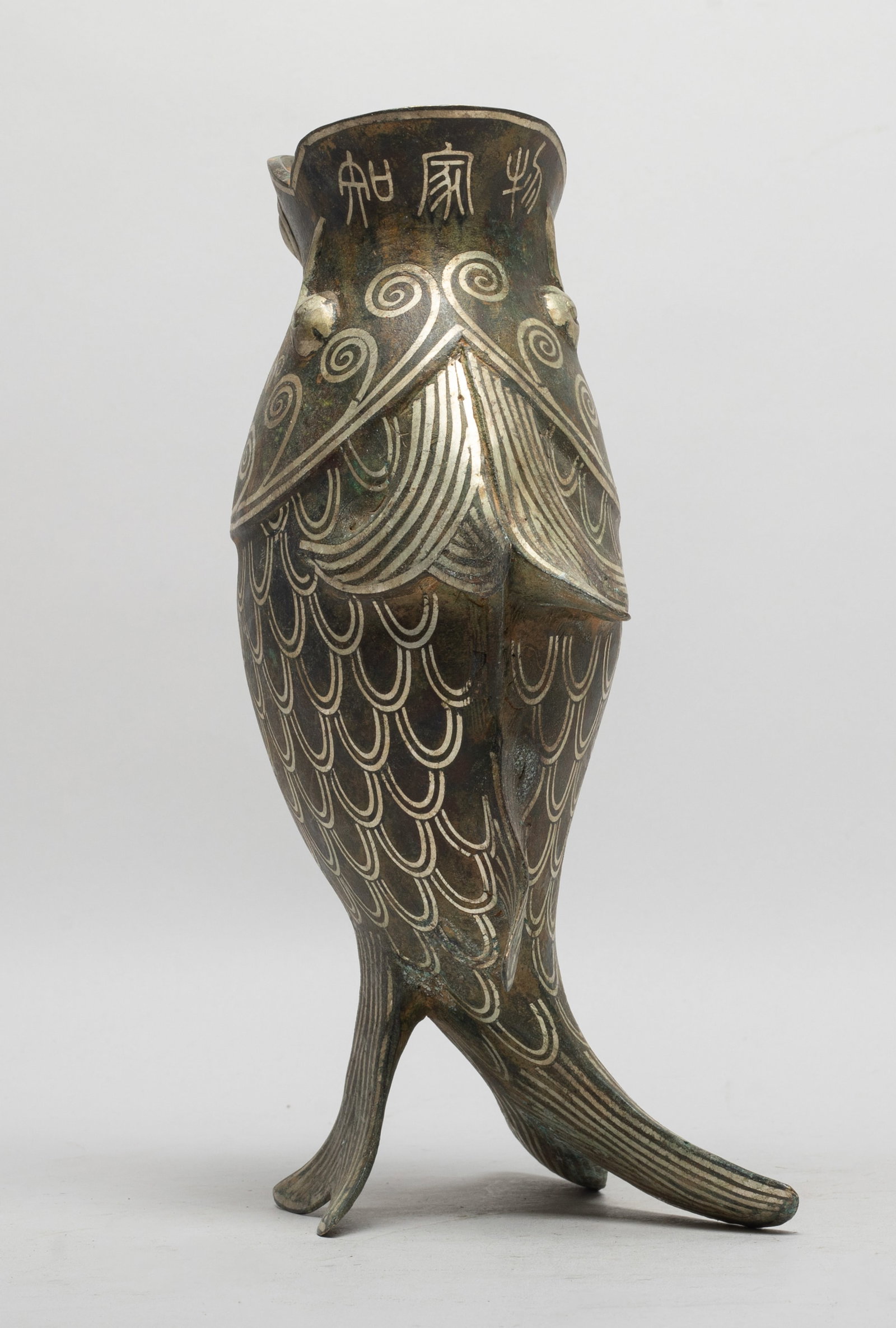 Estate Chinese Bronze Fish Form Vase: Moulded of standing fish form, with rounded bulging eyes, decorated with scrolls, marked with three characters under the mouth. Approx. 9.7*5.5*3.5 inch.