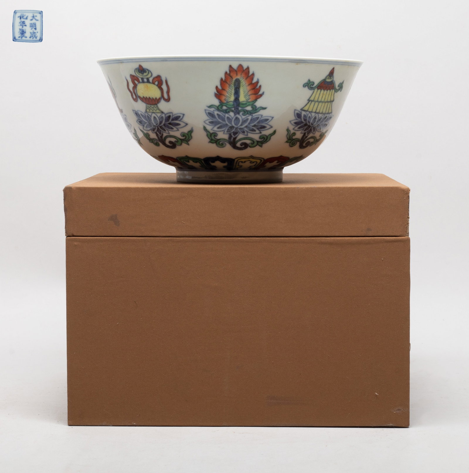 Collectible Chinese Export Large Porcelain Bowl: The bowl interior centre painted with a circular panel of lingzhi, the exterior painted with Buddhist eight treasures above a band of petals, the bottom with a seal mark, with box. Approx. 7.6*3.5