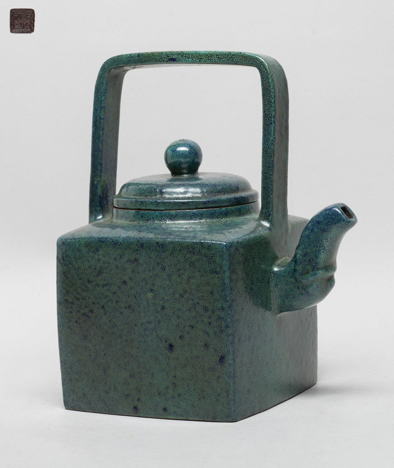Chinese Glazed on Zisha Large Tea Pot: The tea pot of square section, the exterior covered turquoise glaze suffused with dark-blue bubble patterns, the unglazed bottom incised with a seal mark. Approx. 7.6*6.2*4.6 inch.