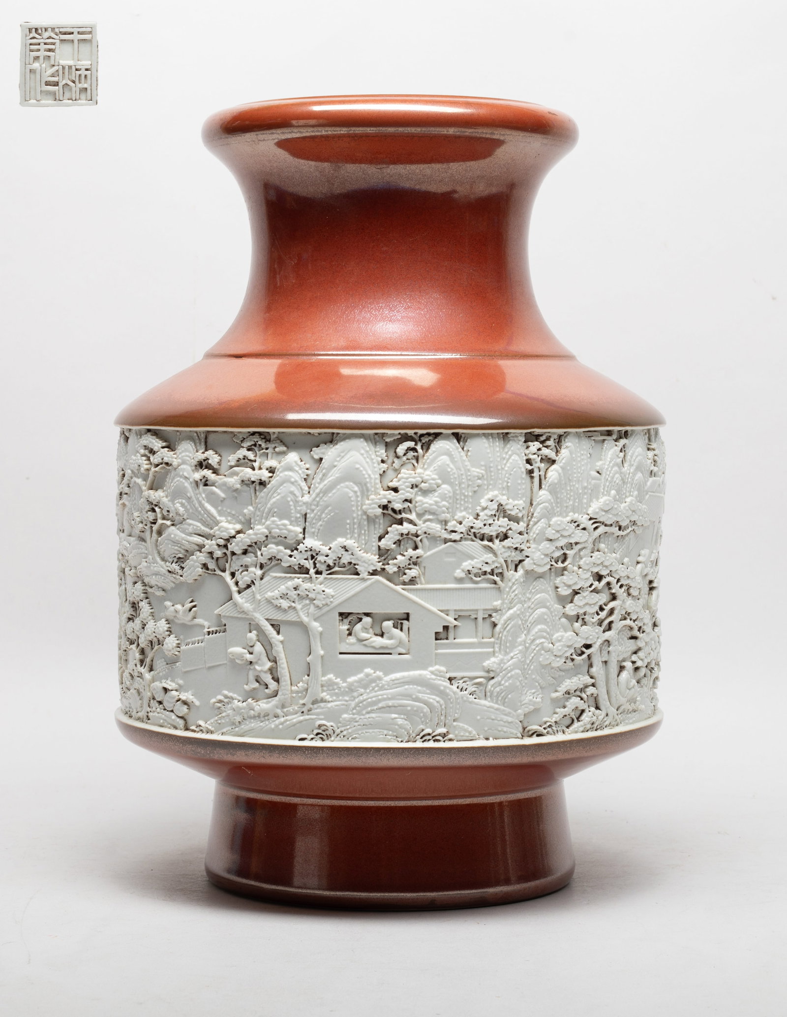 Large Chinese Export Porcelain Relief Vase: The vase body carved with a wide band of landscape scene, glazed in white color, the rest body applied with lustrous russet-red glaze, the white glazed bottom incised with a seal mark. Approx. 12.5*9