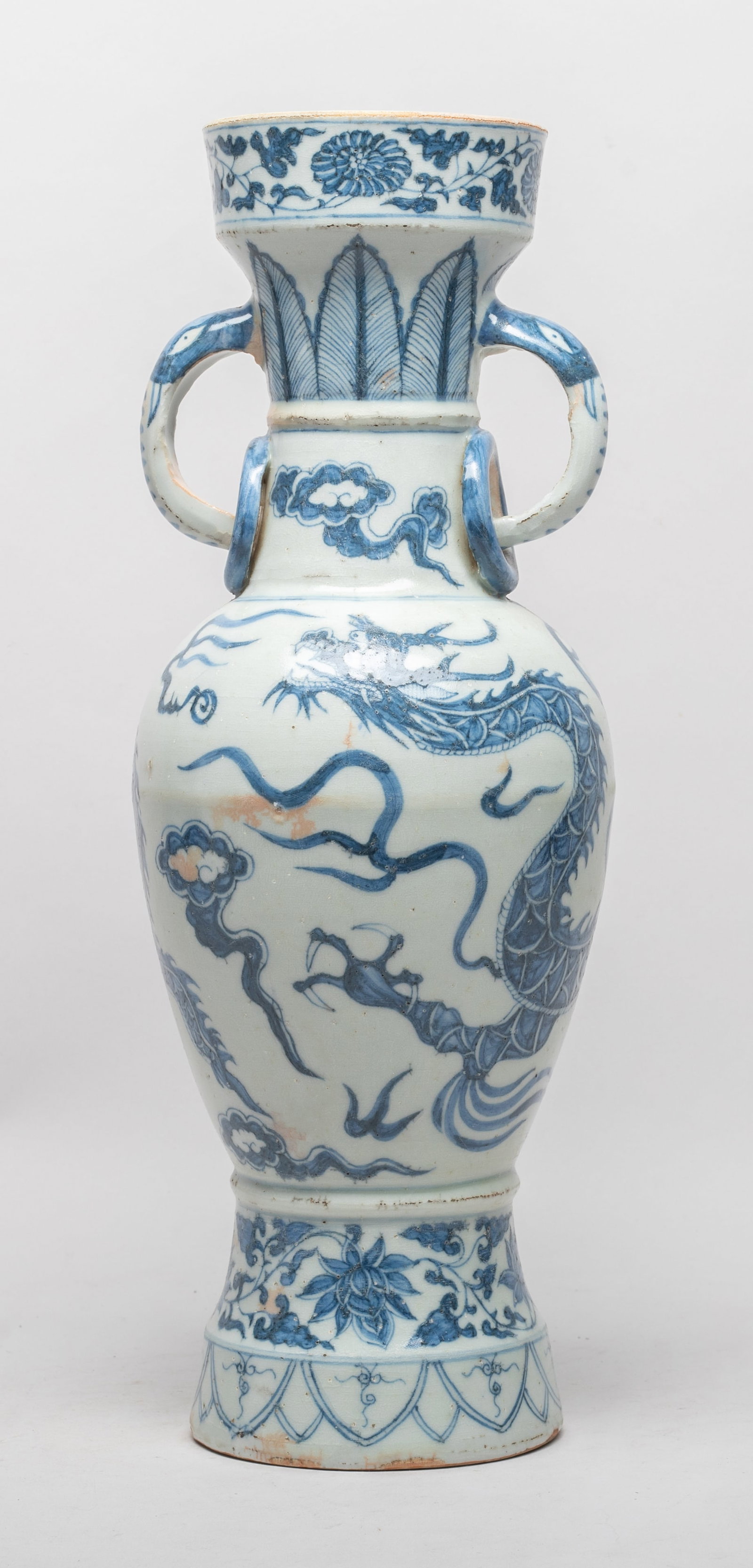 Tall Chinese Shipwreck Type Porcelain Vase: The vase body painted with a dragon pursuing a flaming pearl amidst flames and clouds, above bands of lotus sprays and petals on foot, the neck painted with bands of floral sprays, leaves and clouds,
