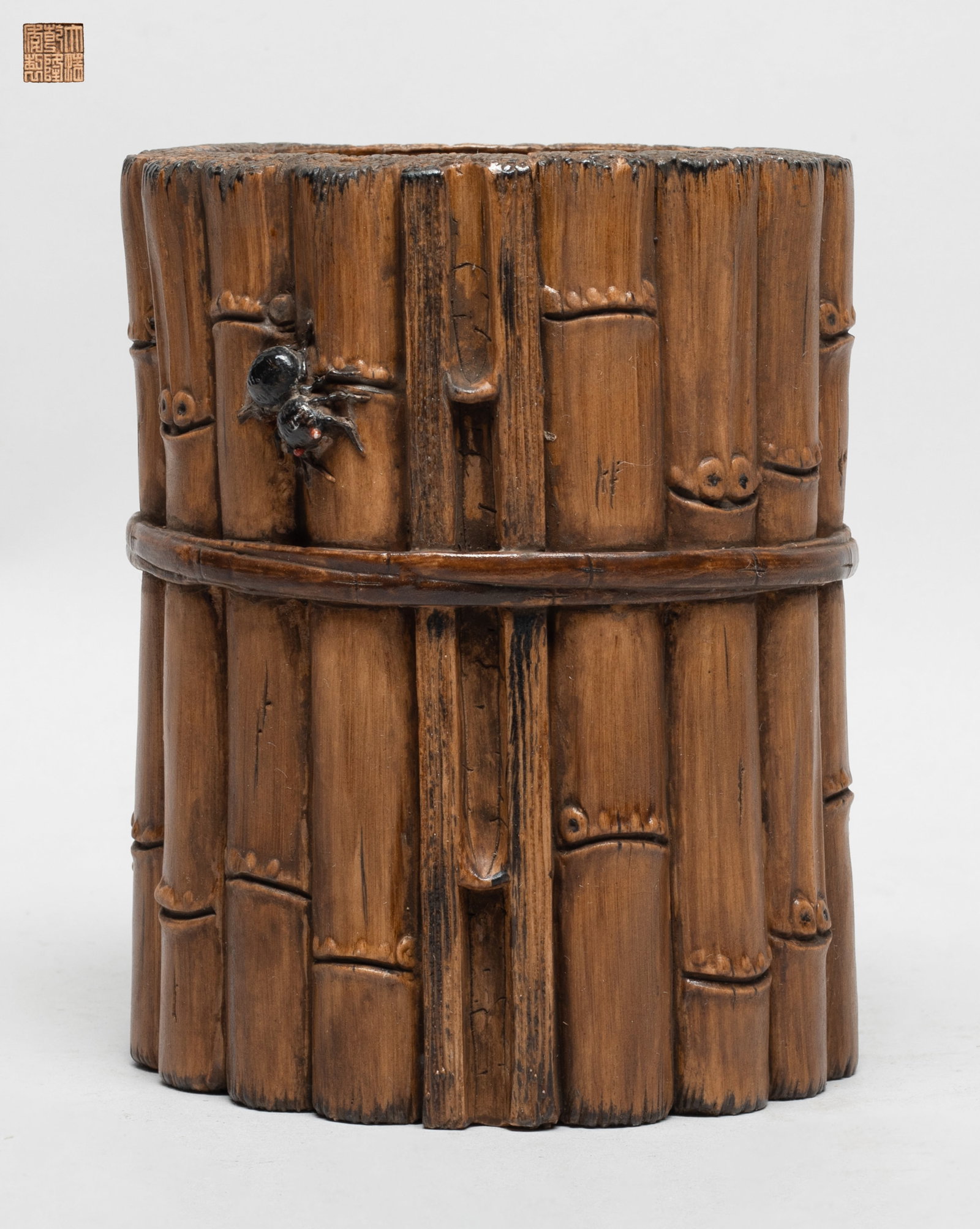 Collectible Chinese Moulded Porcelain Brush Pot: Moulded in form of bundled bamboo poles, the bottom incised with a six-character mark. Approx. 4.6*5.7 inch.