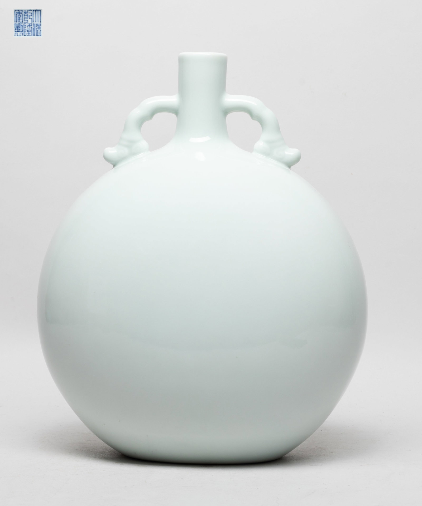 Large Chinese Bean Green Glazed Porcelain Vase: Of rounded shape with a cylindrical neck flanked by two handles, covered with pale bean green glaze, the bottom with a six-character mark. Approx. 11.7*9.7*6.2 inch.