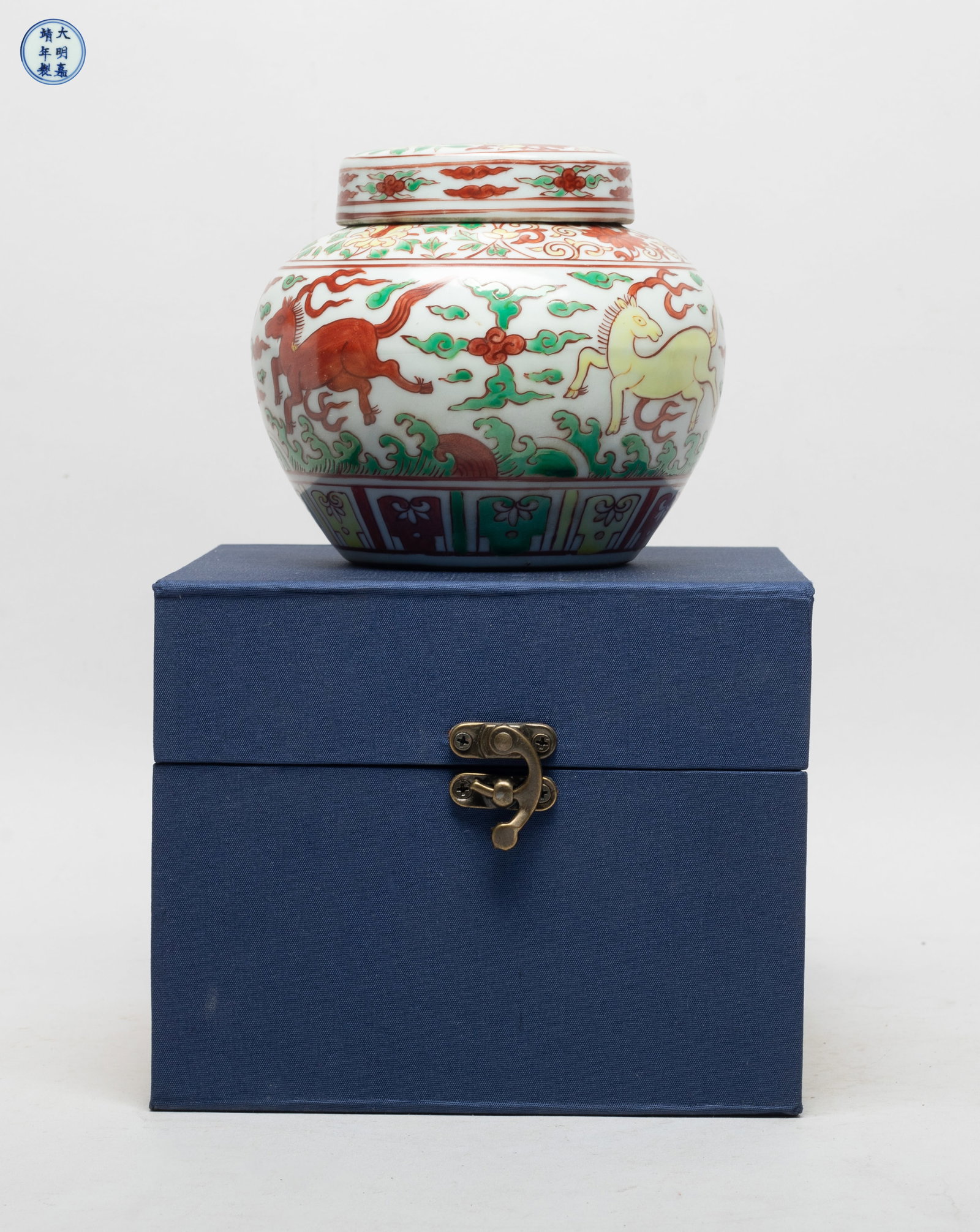 Estate Chinese Export Porcelain Jar: The jar body painted in red, green and yellow with horses amidst clouds above waves, between bands of foliage and lappets, the lid with foliage pattern, the bottom marked with six characters enclosed