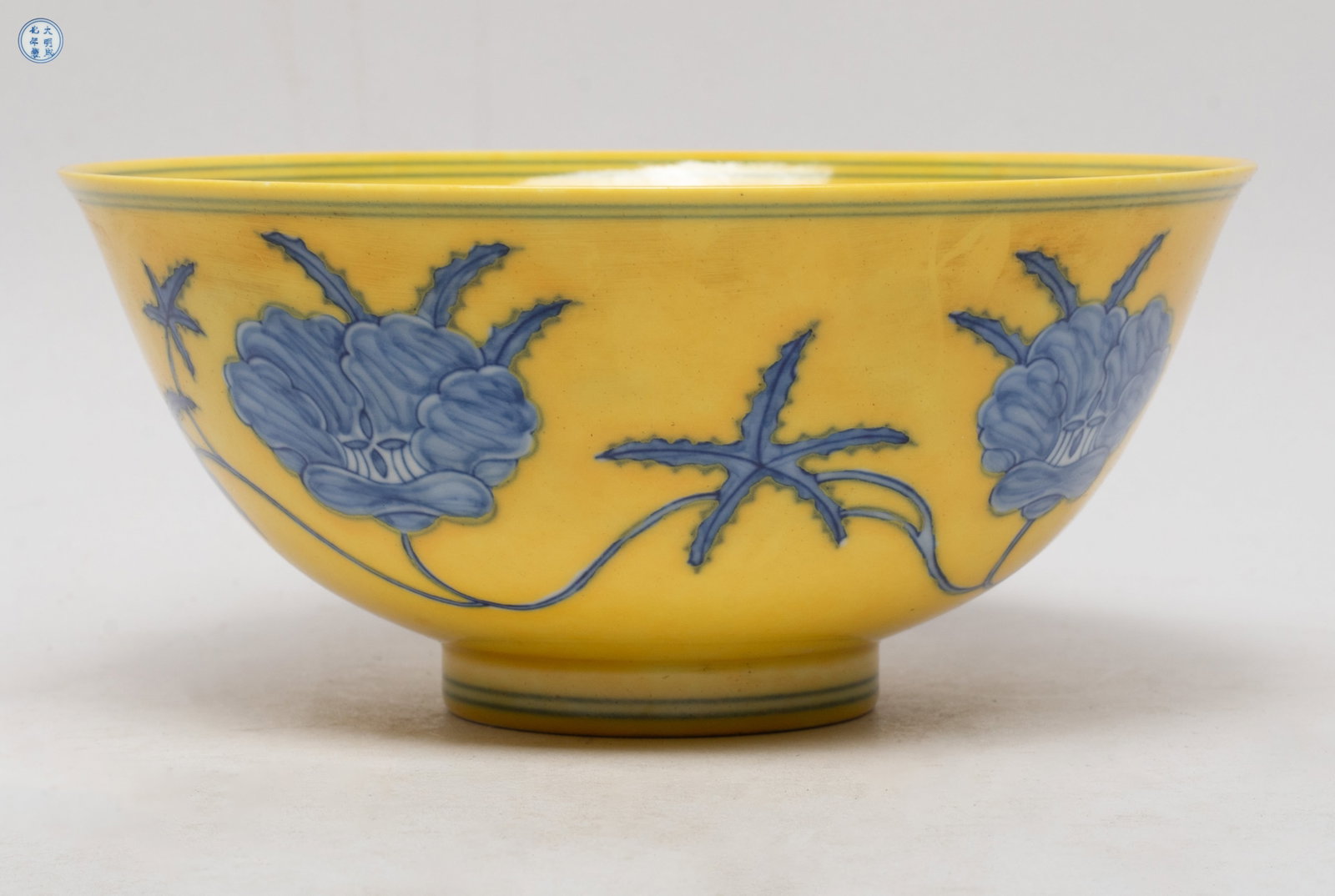 Chinese Export Porcelain Bowl: The bowl inside and out painted with meandering floral sprays, on bright yellow glazed ground, the bottom marked with six characters enclosed in double circles. Approx. 6*2.7 inch.