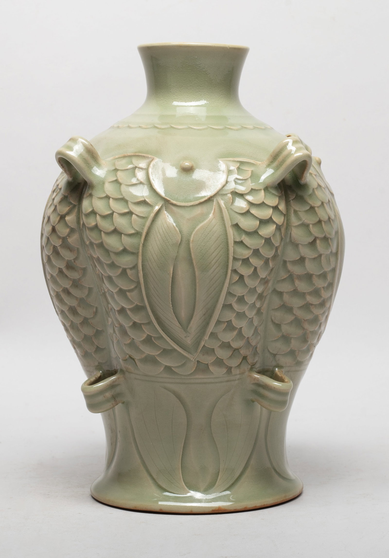 Unusual Chinese Yaozhou Porcelain Vase: Special form porcelain vase carved with scaly fish patterns, set with eight raised handles, overall covered with bubbled olive-green glaze. Approx. 9.5*7 inch.