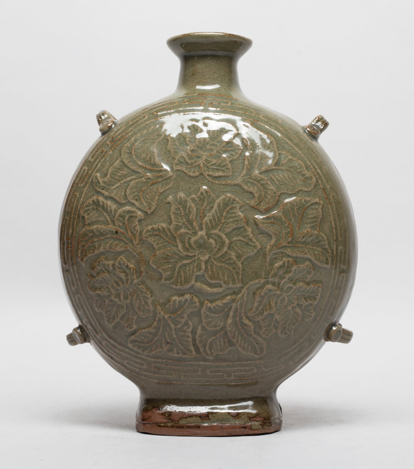 Estate Chinese Yaochou Type Porcelain Vase: Of flattened rounded form, either side carved with flowers and leaves, the exterior covered with crackled olive-green glaze. Approx. 8.1*6.2*3.2 inch.