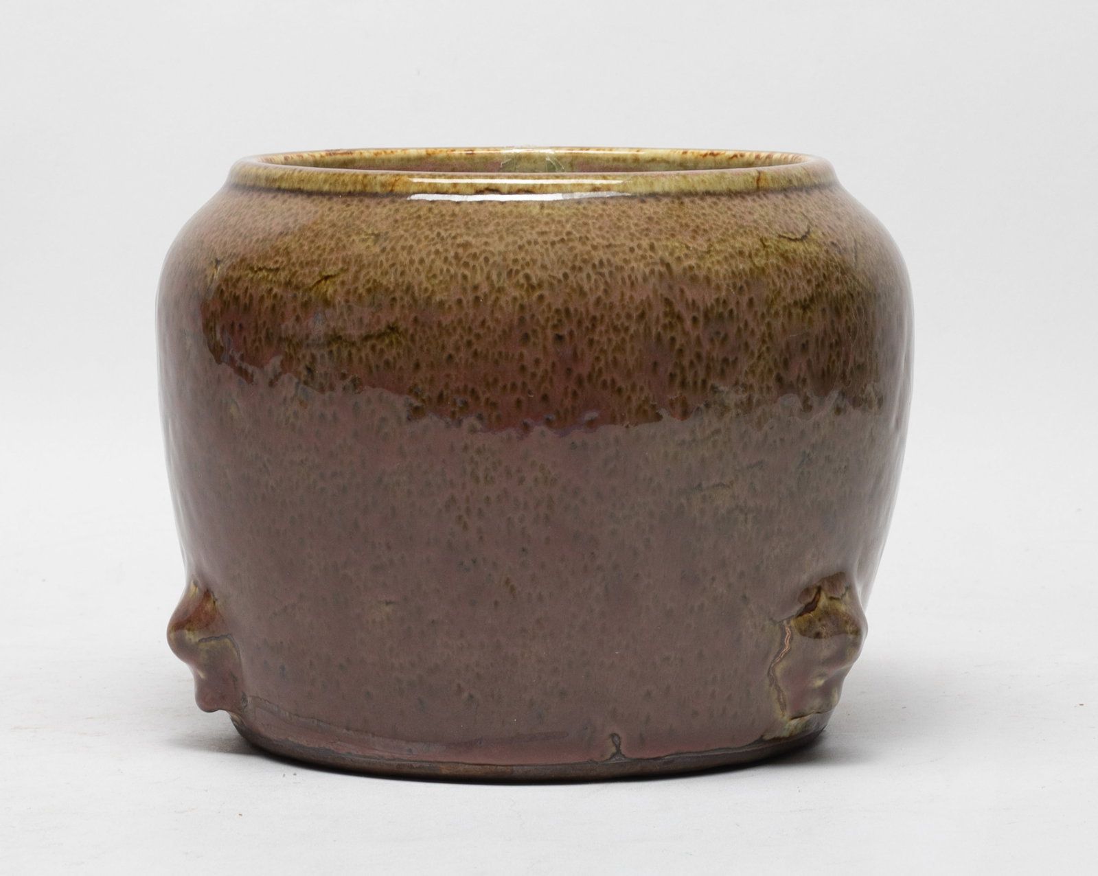 Chinese Flambe Glazed Porcelain Washer: The large washer exterior covered with mottled brown glaze, carved in high relief with three raised masks above the foot, the interior covered with crackled grayish white glaze. Approx. 7.2*5.5 inch.