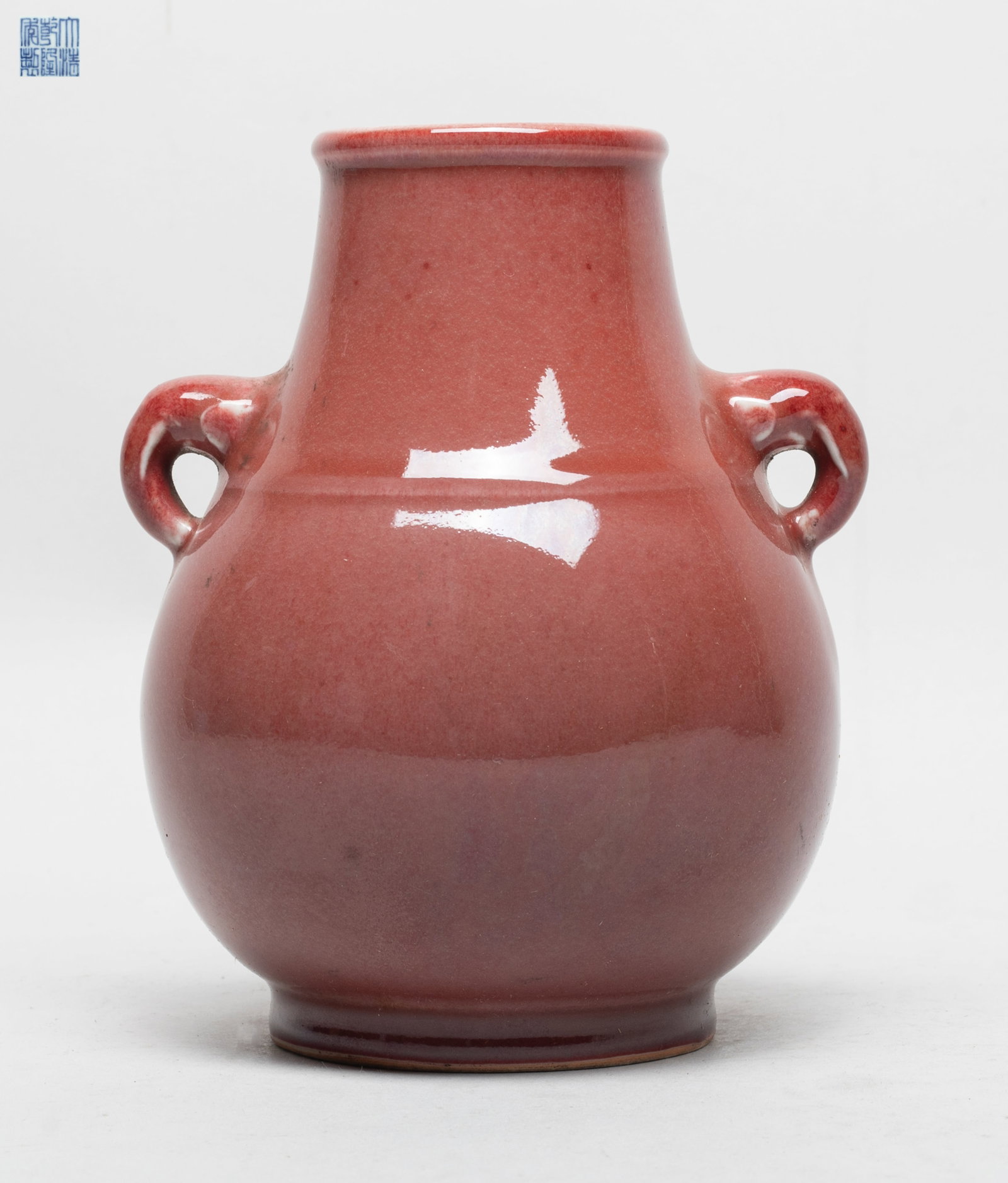 Estate Chinese Red Glazed Porcelain Cabinet Vase: Of pear shape with a short foot and two handles, the exterior covered with mottled red glaze, the bottom with a six-character mark. Approx. 5*4.5*6.2 inch.