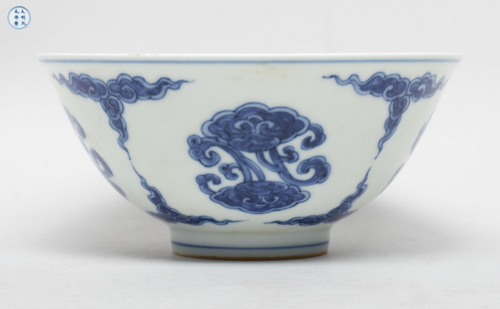Chinese Blue & White Porcealain Bowl: The bowl exterior painted with lingzhi separated by clouds, the interior centre with similar lingzhi, the bottom marked with six characters enclosed in double circles. Approx. 5.8*2.7 inch.