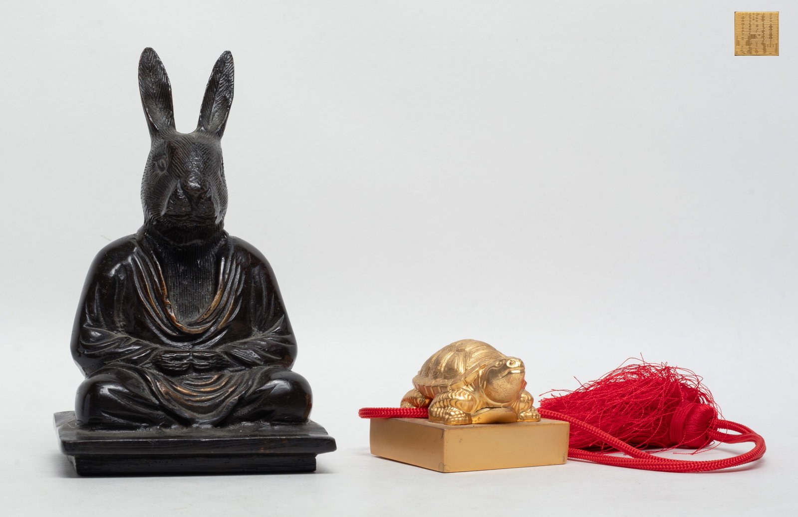 Two Chinese Bronze Sculptures: One cast as a seated figure with a rabbit head, the other as a seal with a turtle finial. Approx. 6.2*3.9*3 inch (figure size).
