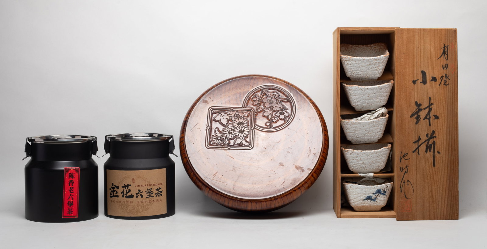 Japanese Stoneware, Large Box: Including two cans of Chinese export tea, set of five Japanese stoneware bowls, and a large box. Approx. 12.2*4.7 inch (box size).