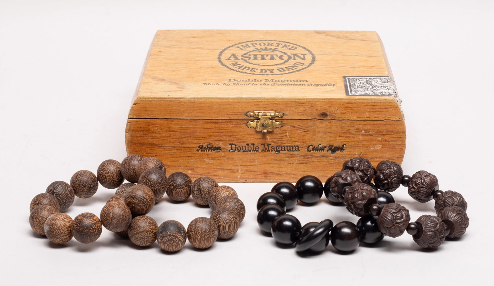 Chinese/ South Asian Agarwood Prayer Beads: Set of four Chinese / South Asian strings of agarwood carved prayer beads, wherein one string of beads carved of lotus form, with box. Approx. 204 gram (total bead weight), 0.8 inch D (largest bead