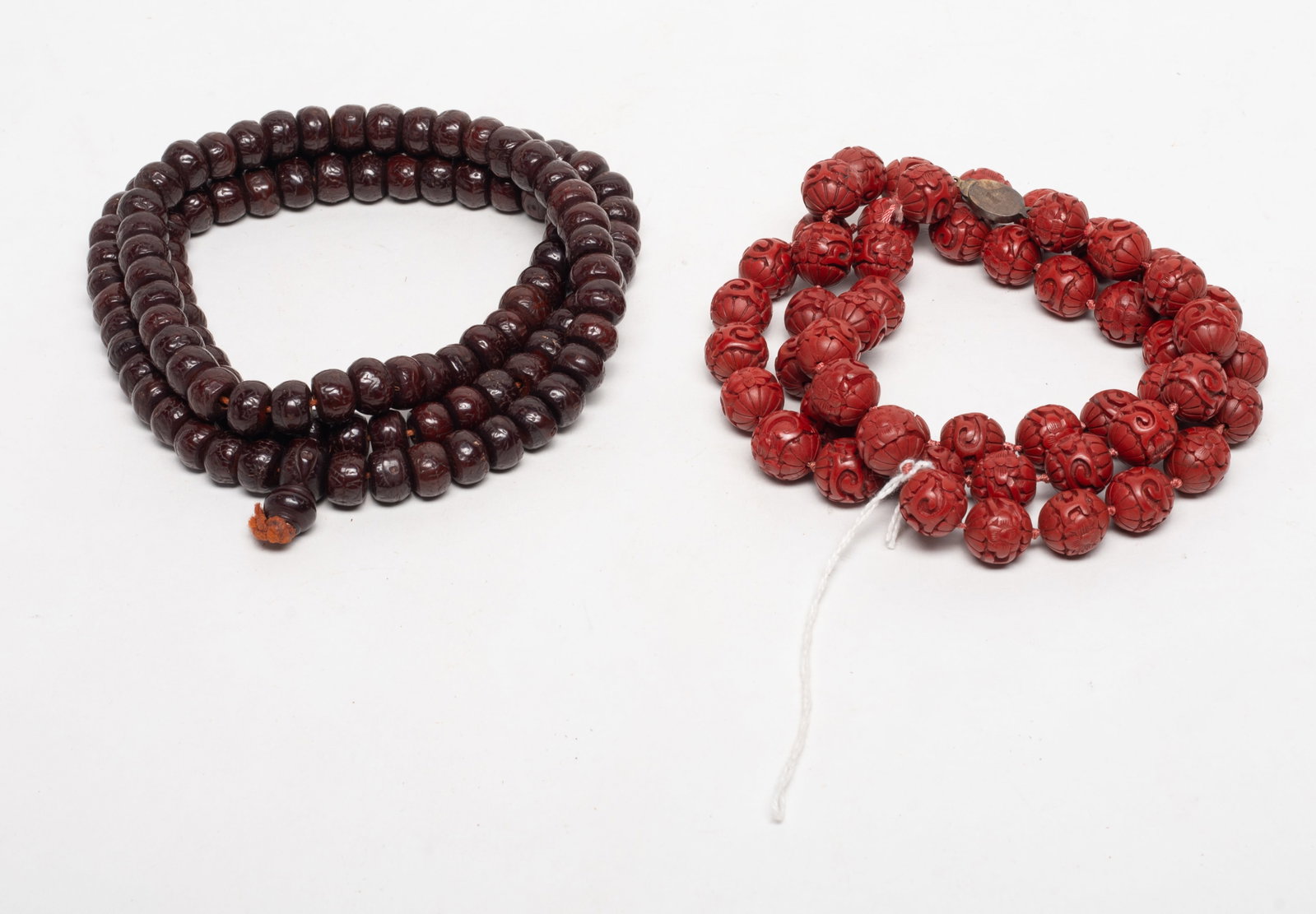 Chinese Export Cinnabar, Seed Beads: Two long strings of Chinese cinnabar beads and seed beads. Approx. 39 inch L (longer).