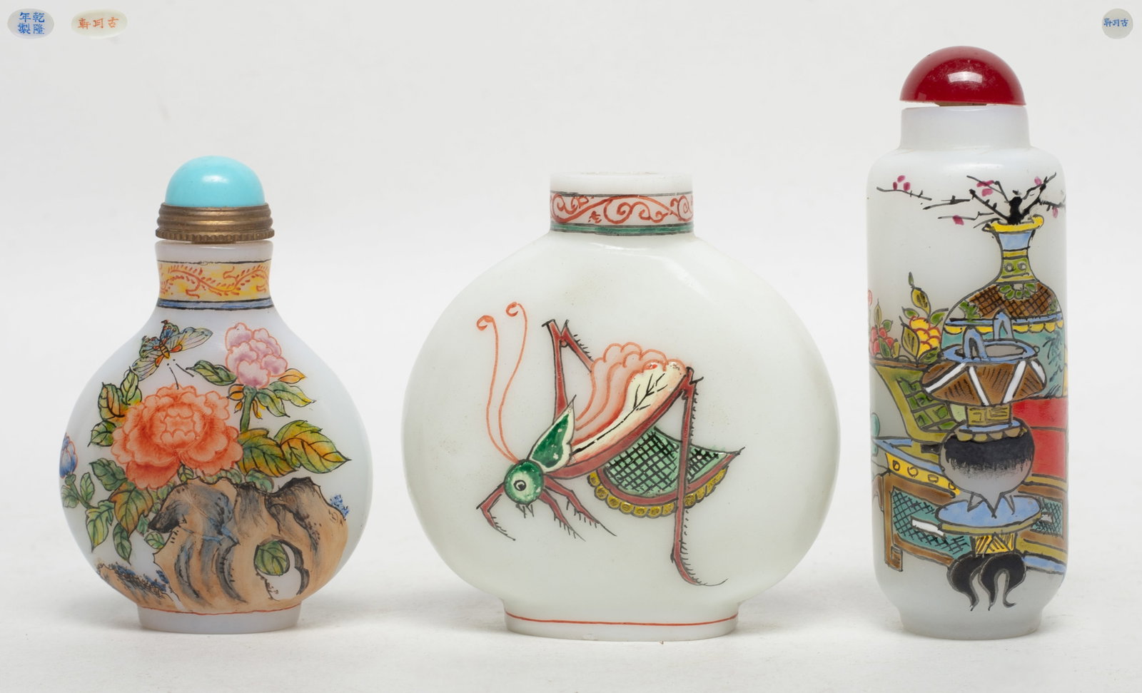 Set Chinese Peiking Glass Snuff Bottles: Set of three Chinese Peiking glass snuff bottles, painted bogu pattern, grasshopper, or flower and butterfly, each bottom marked three characters. Approx. 2.55*2.45*1.13 inch (largest).