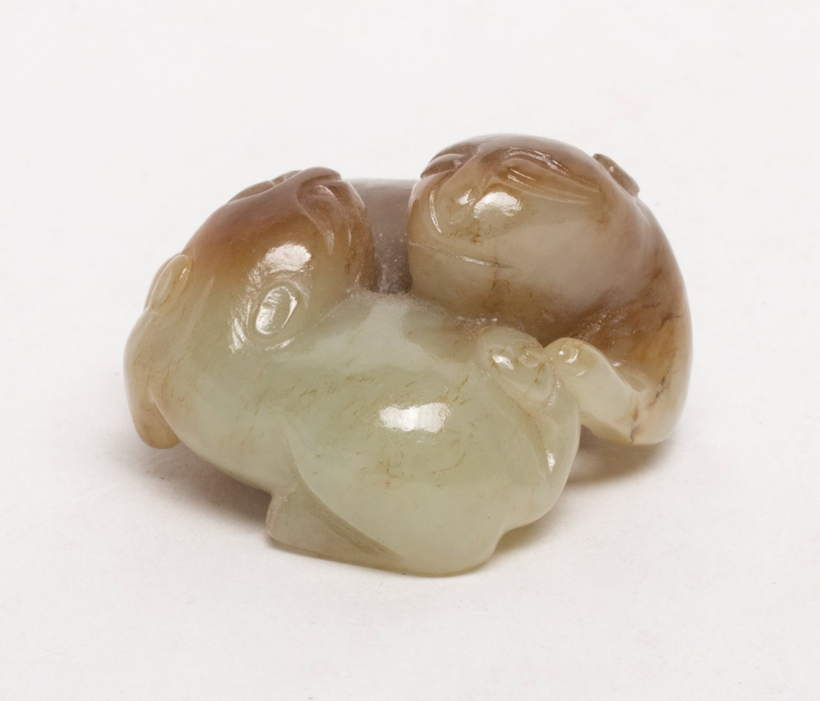 Chinese Russet Jade Carved Huanhuan: Chinese russet jade sculpture carved as a pair of recumbent huanhuan. Approx. 1.75*1.65*1.05 inch.