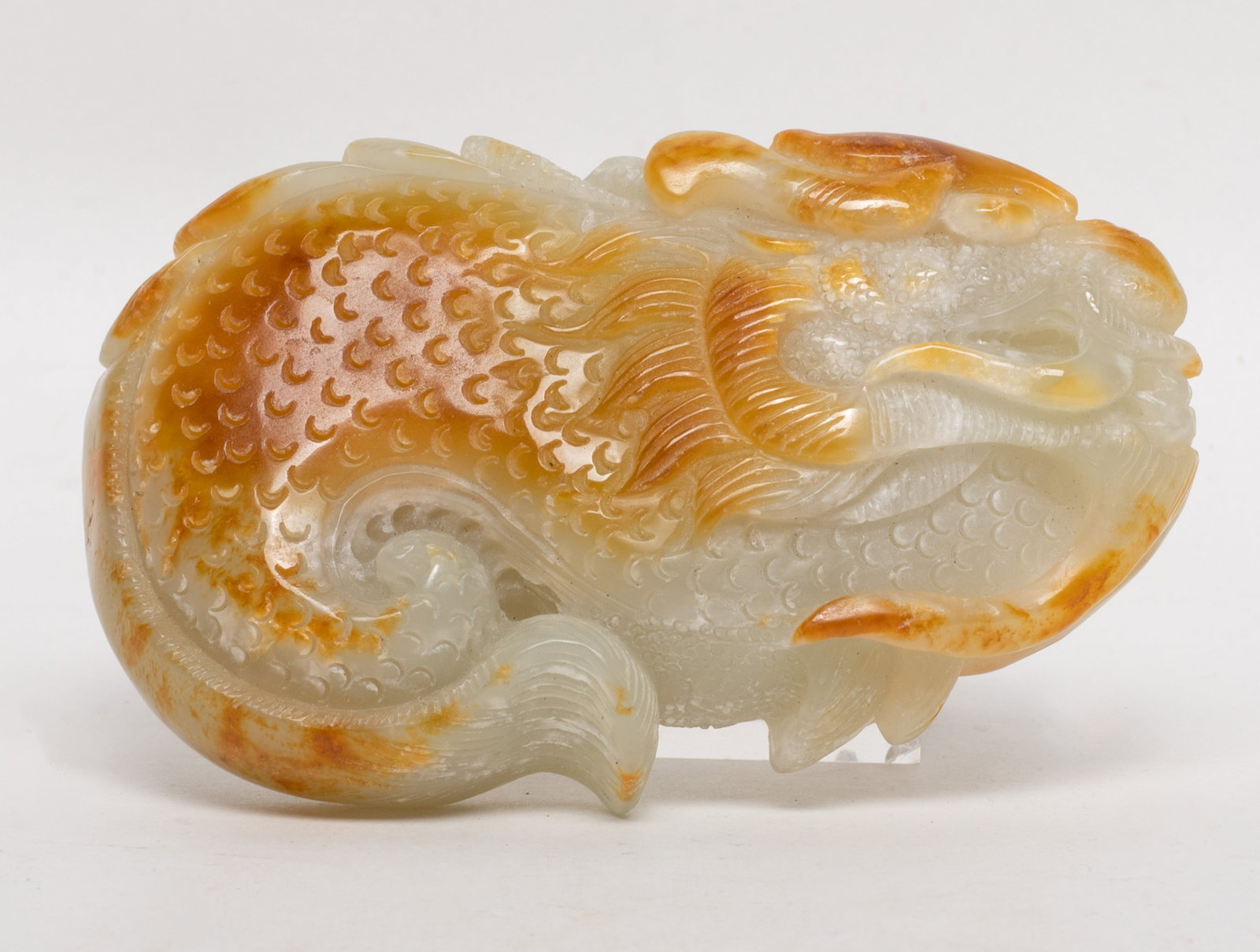 Vintage Chinese Russet Jade Pendant: Large Chinese russet jade pendant worked of stylized dragon form. Approx. 3.9*2.4*0.9 inch.