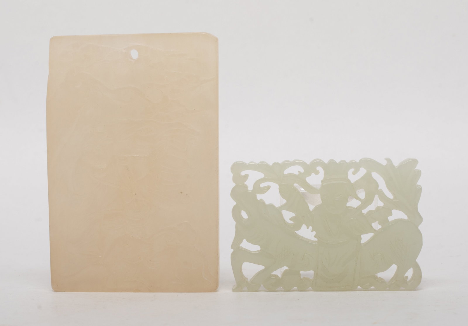 Two Chinese Jade Carved Pendants: Two Chinese jade plaques, one carved figure, deer and bat, the other carved figure and beast. Approx. 2.6*1.7 inch (larger).