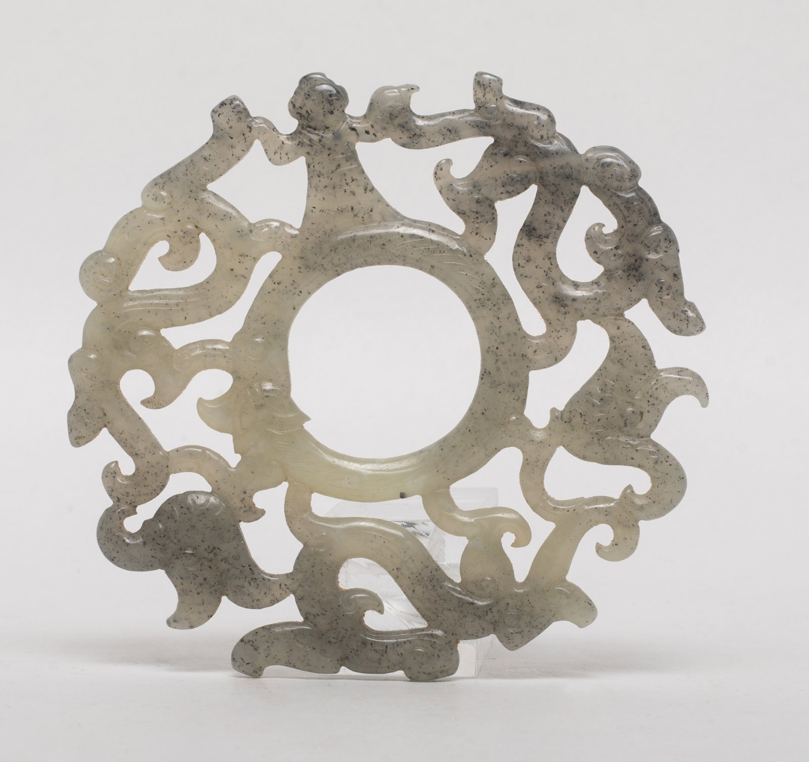 Chinese Black & White Jade Rounded Pendant: Chinese black and white jade pendant carved in openwork with figure and dragons. Approx. 2.93*2.75 inch.
