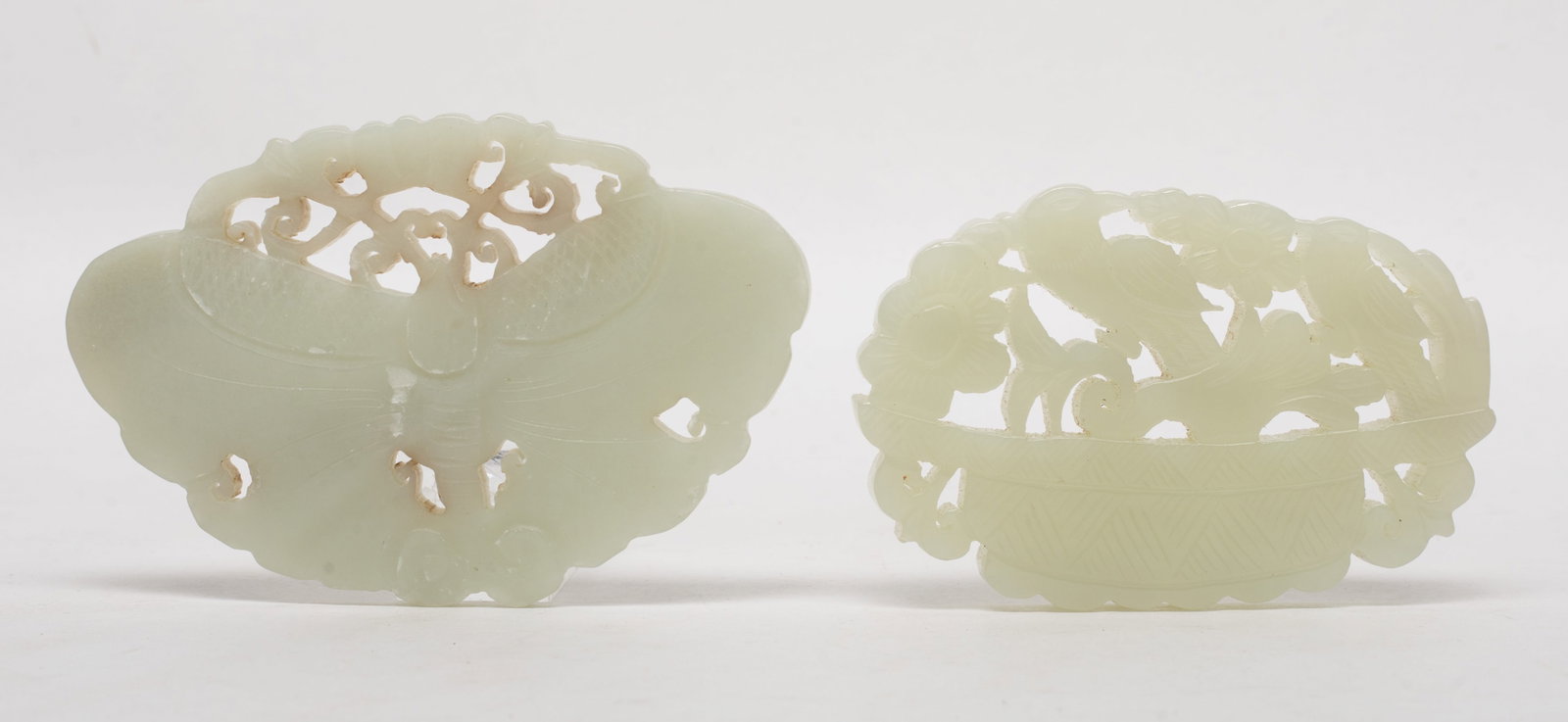 Two Chinese Openwork Jade Plaques: Two Chinese openwork jade plaques, one carved with birds and flowers, the other carved as butterfly. Approx. 3.42*2.25 inch (larger).