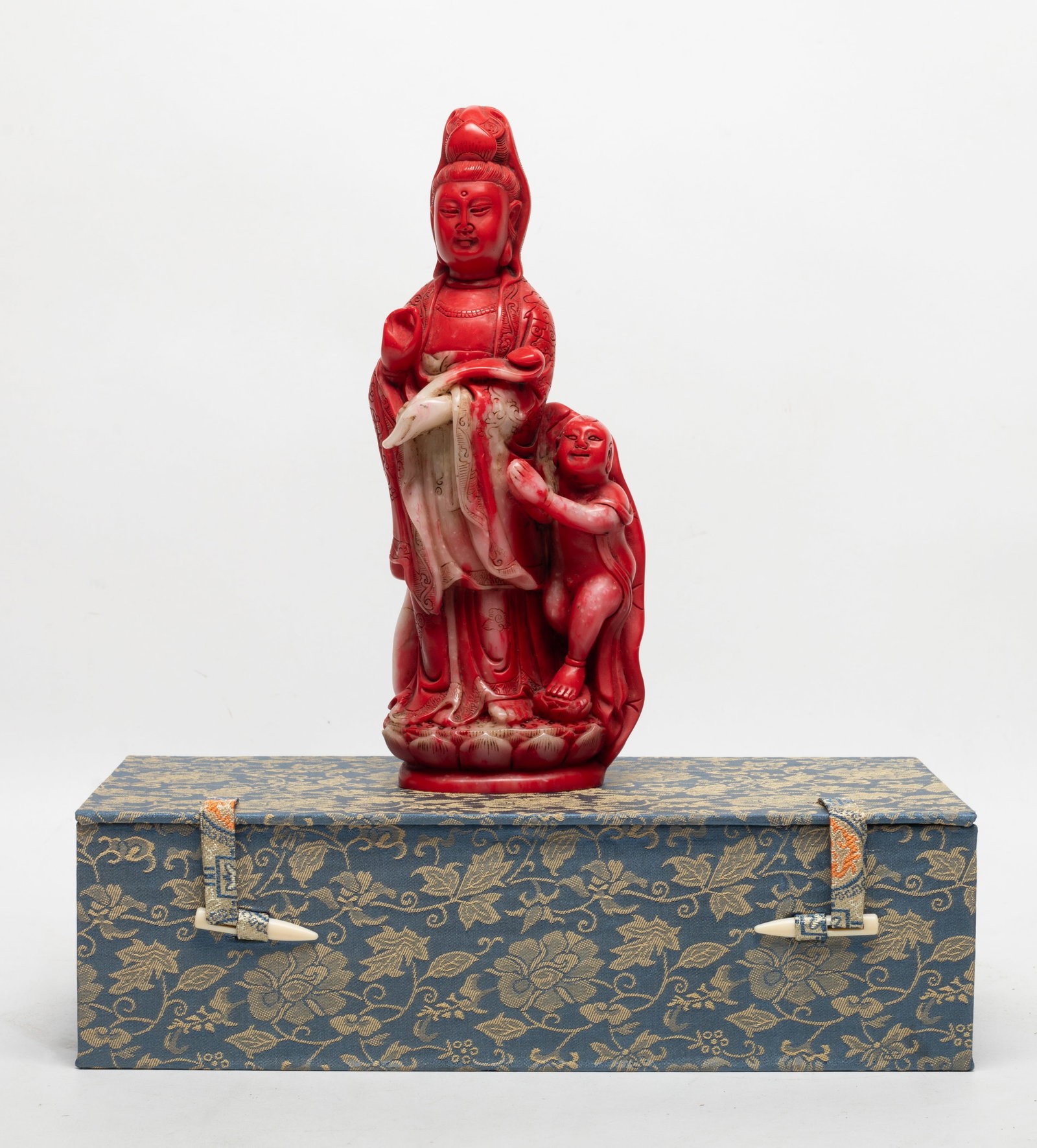 Chinese Stone Sculpture of Buddha: Chinese stone sculpture carved as Kuanyin and boy standing on a lotus base, with box. Approx. 8.5*3.3*2.1 inch (w/o box).