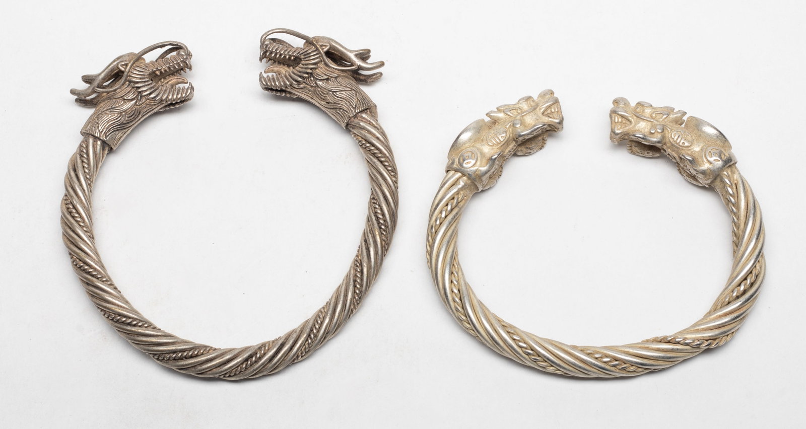 Two Vtg. Chinese Export Dragon Bangles: Two vintage Chinese dragon bangles. Approx. 3.7 inch width (larger bangle).