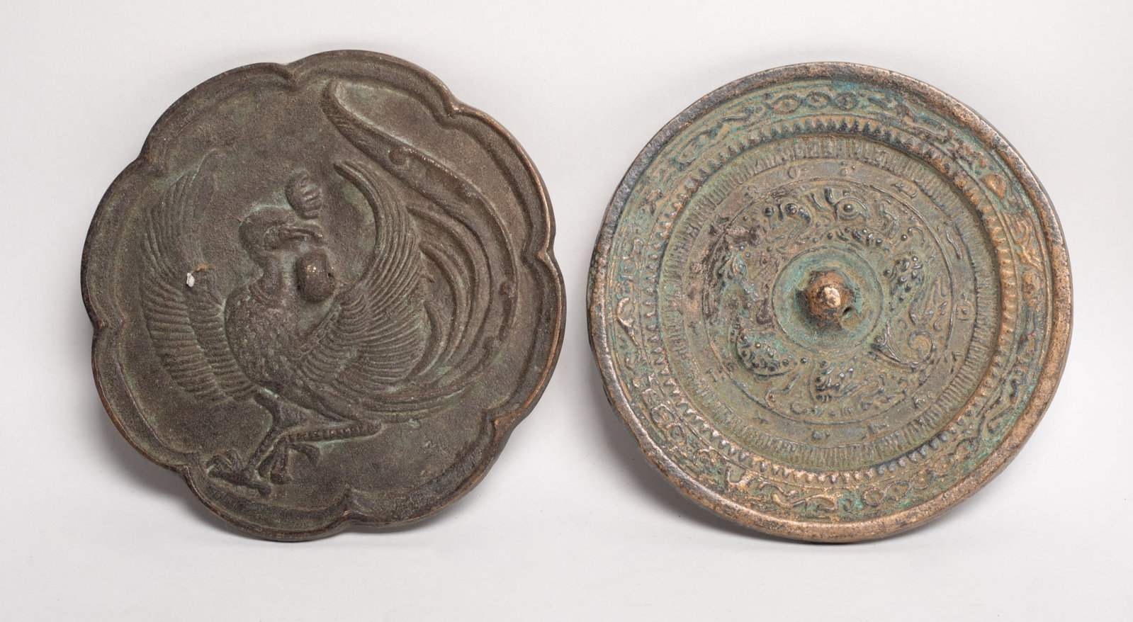 Two Chinese Bronze Mirror Collections: Two Chinese bronze mirrors cast with archaic patterns. Approx. 4.9 inch D (larger).