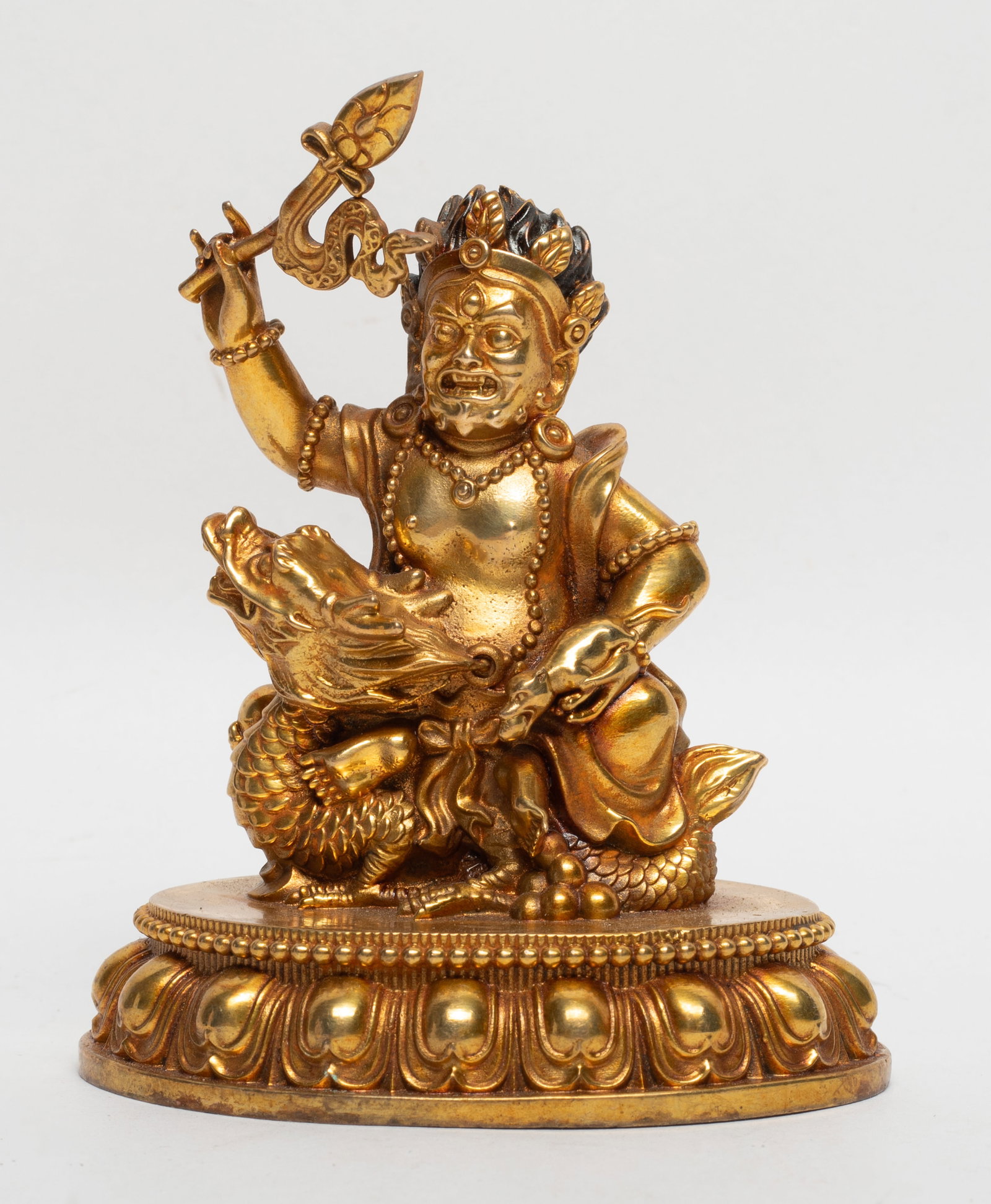 Chinese Sino-Tibetan Gilt Bronze Buddha: Chinese Sino-Tibetan gilt bronze sculpture cast as Buddha seated on dragon on lotus base. Approx. 3.9*3.2*2.3 inch,