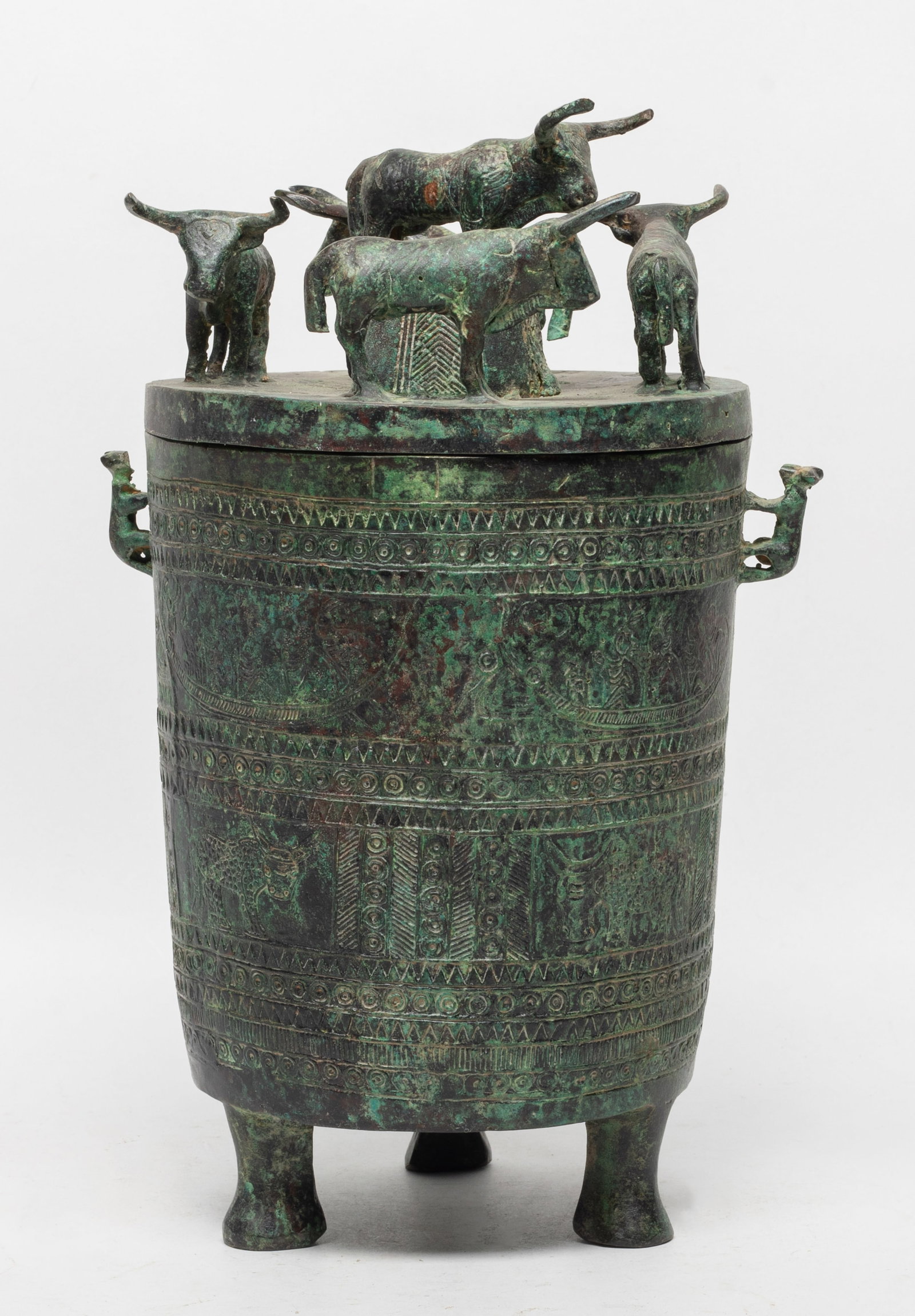 Special Chinese Bronze Covered Pot: Chinese bronze covered pot, incised with mythical motif, the top with five buffalo. Approx. 10*6.5*5.5 inch.