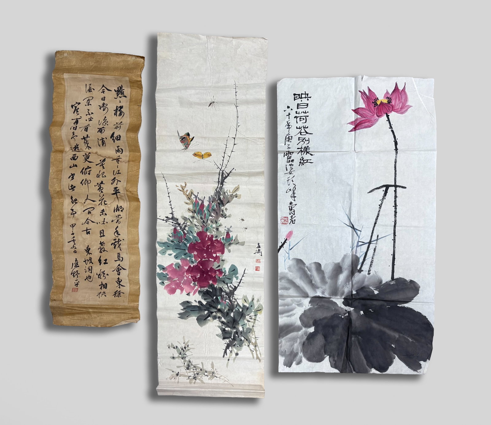 Three Chinese Watercolor Paintings: Two Chinese watercolor paintings of flowers and a calligraphy. Approx. 39*19 inch (larger).