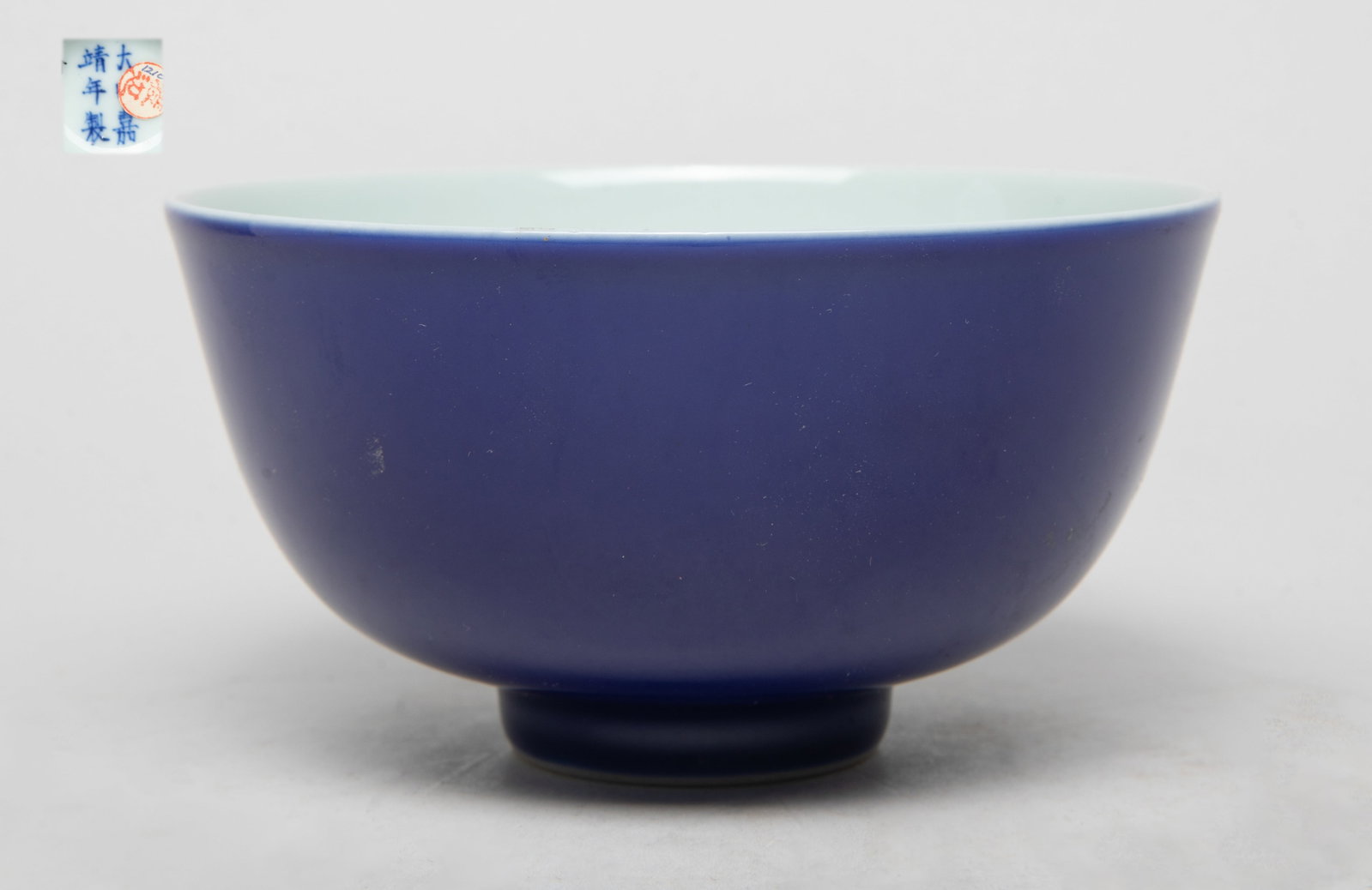 Chinese Blue Glazed Porcelain Tea Bowl/ Cup: The exterior applied with even blue glaze, the bottom marked with six characters. Approx. 4.5*2.4 inch. The Estate of the Store Closed Sale, DTLA, 2023.