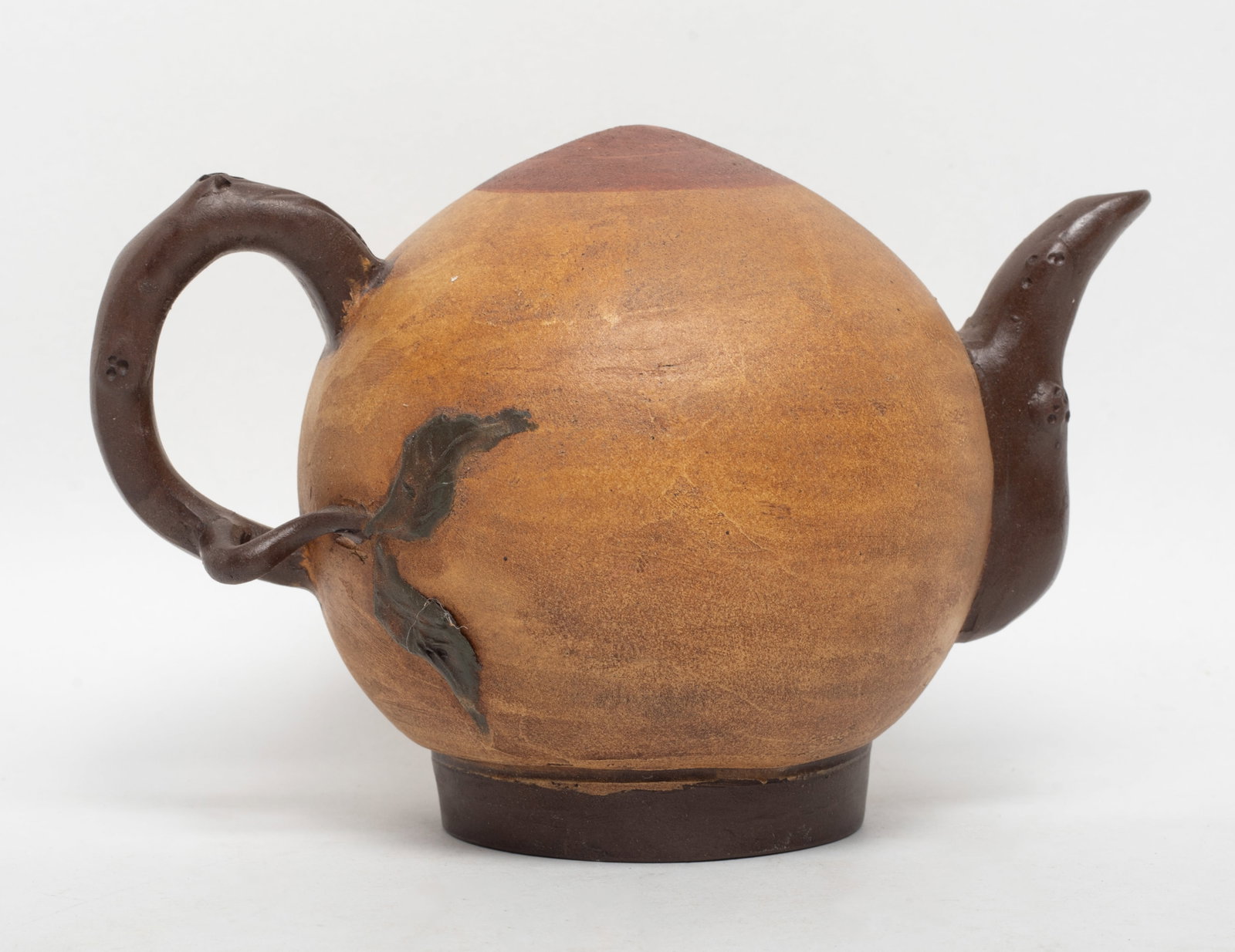 Unusual Chinese Yixing Zisha Pot: Chinese Yixing zisha pot of special peach form, incised circular mark to the bottom. Approx. 6.4*4.2*4.2 inch.