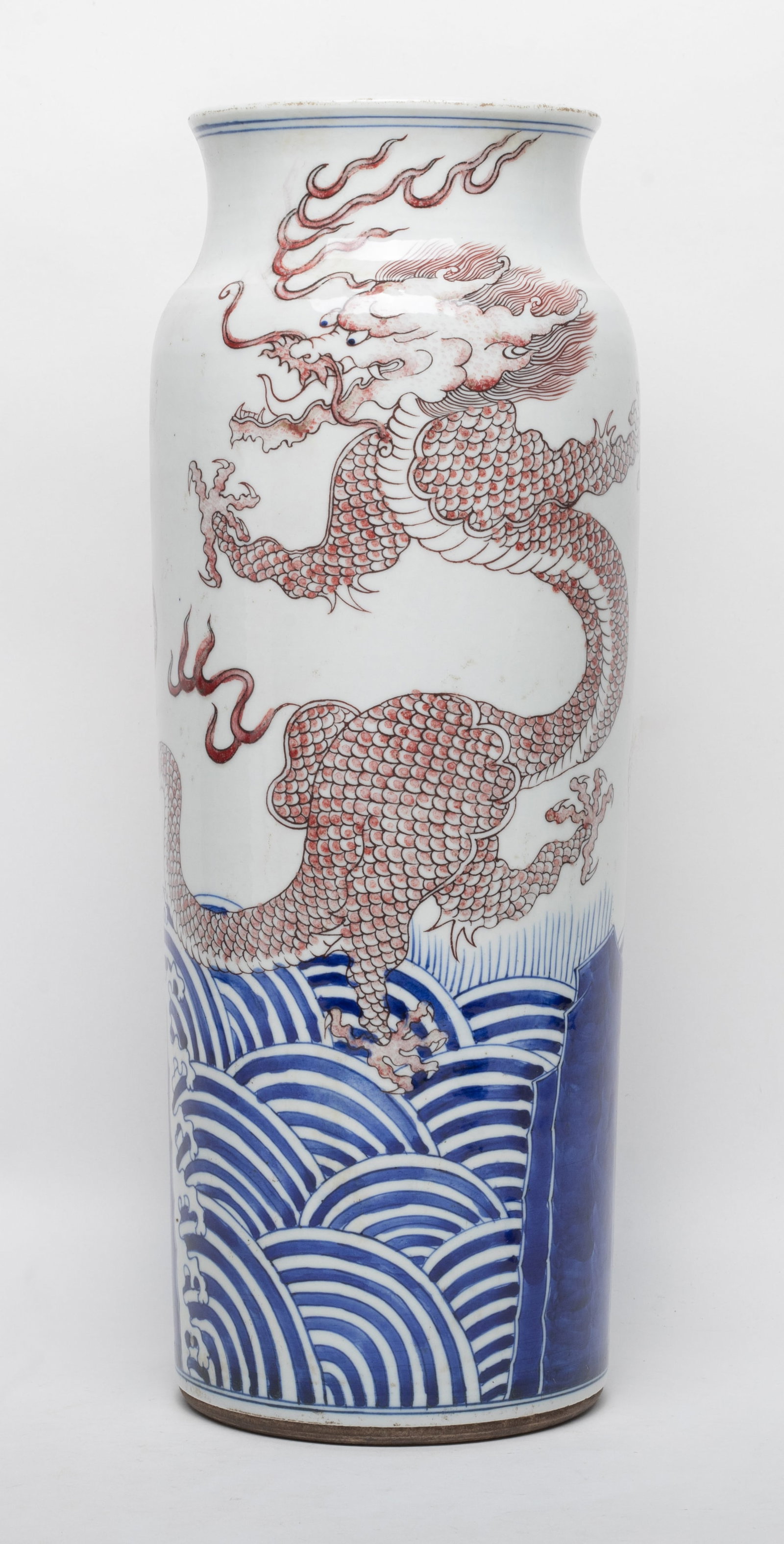 Tall Chinese Porcelain Dragon Vase: Tall Chinese porcelain vase painted with copper red dragons above blue waves. Approx. 14.8*5.2 inch.