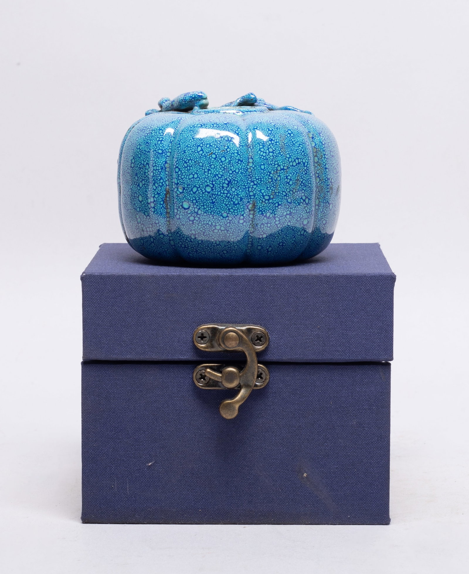 Chinese Flambe Glazed Porcelain Water Pot: Moulded of pumpkin form, carved around the mouth in high relief with a chi dragon, the exterior applied turquoise glaze suffused with blue bubble motif, with box. Approx. 3.1*2.4 inch (w/o box).