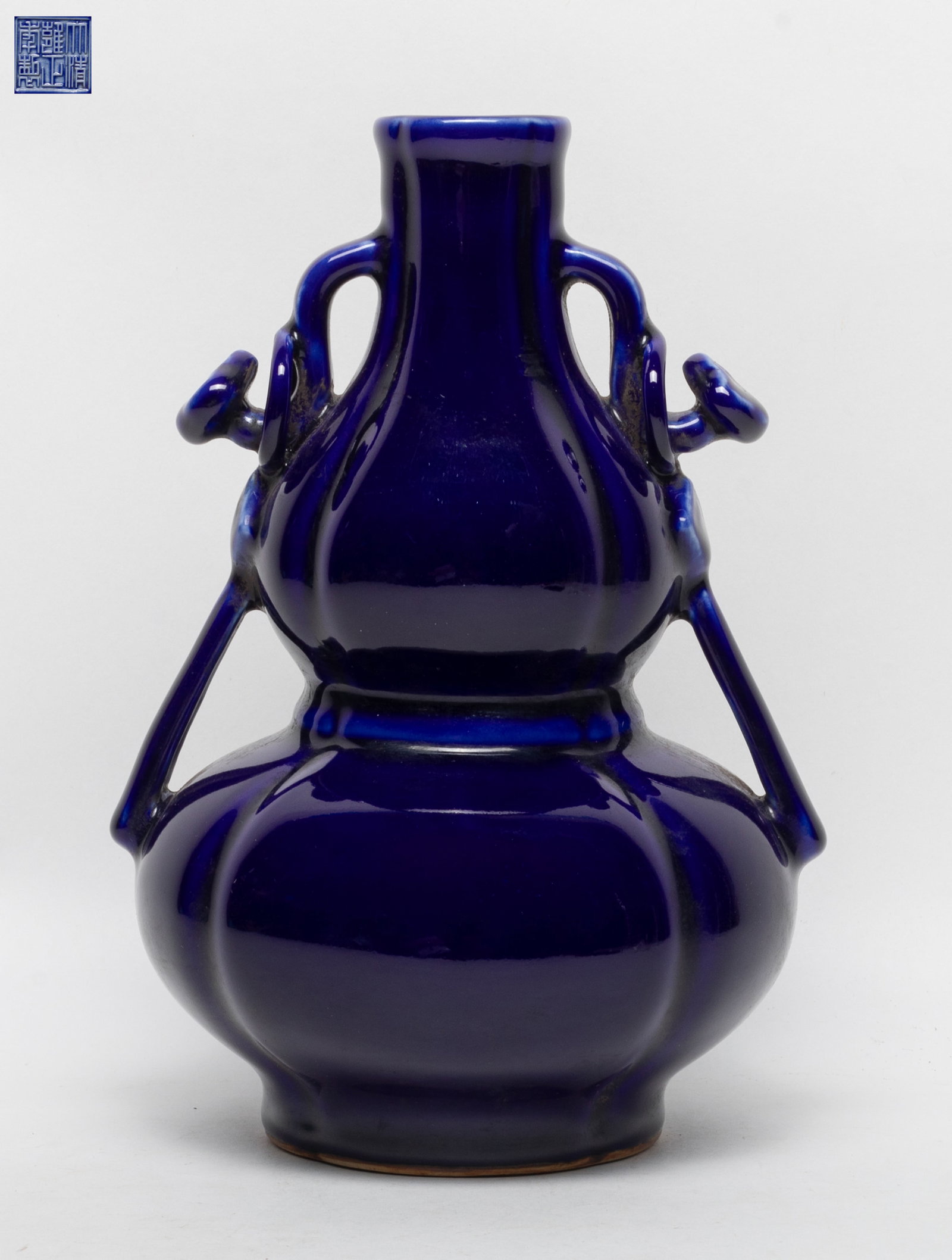 Chinese Rich Blue Porcelain Gourd Vase: Chinese deep blue glazed porcelain gourd vase, incised six-character mark to underside. Approx. 9*6.1*5.5 inch.