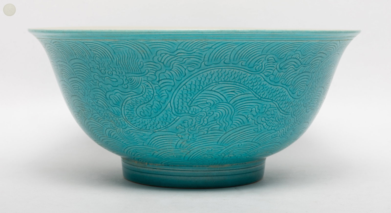 Large Chinese Turquoise Glazed Porcelain Bowl: Large Chinese turquoise glazed porcelain bowl incised dragons over waves, marked six characters enclosed in double circles to bottom. Approx. 8.1*3.6 inch.