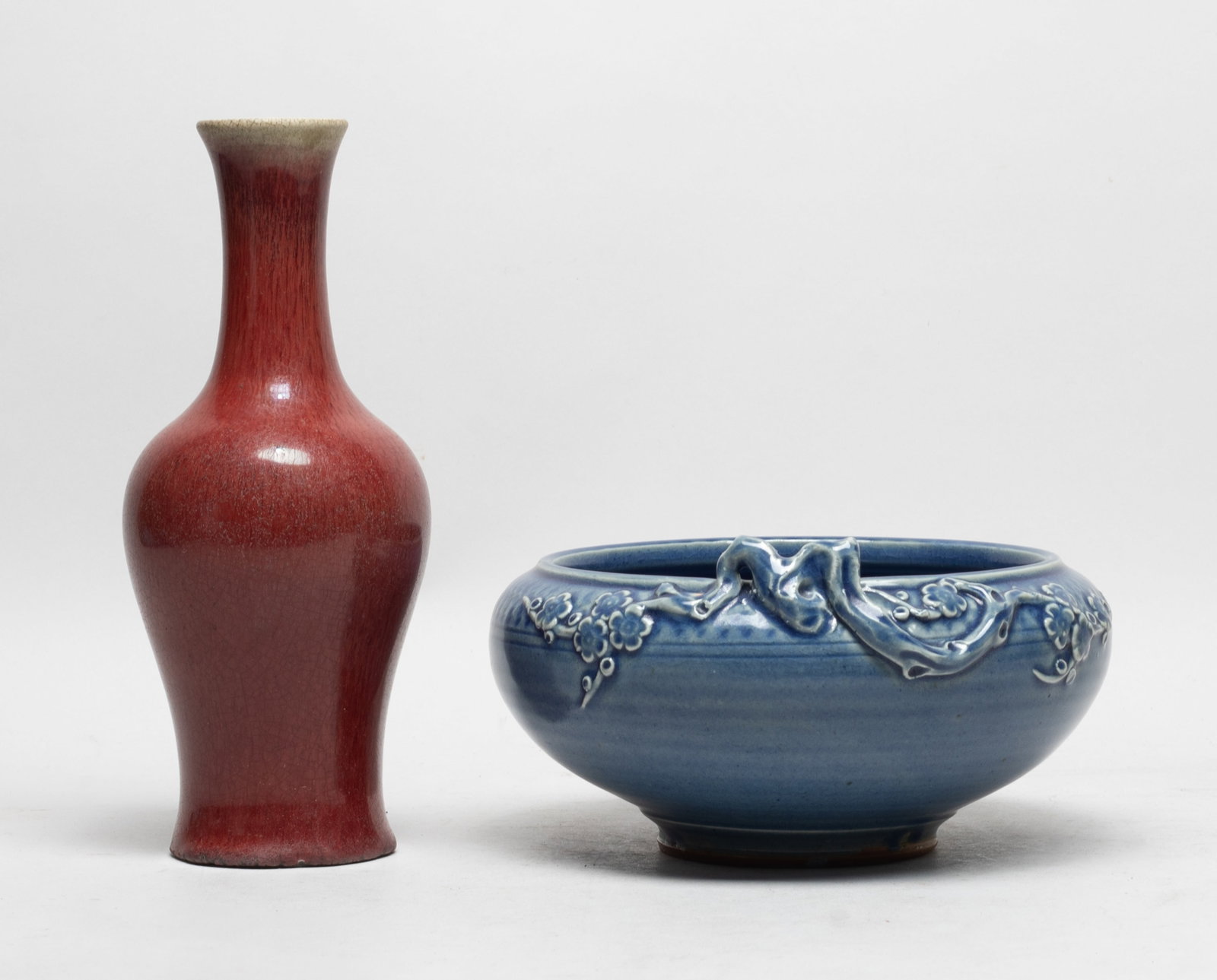 Large Chinese Export Porcelain Washer, Vase: The tapered washer carved around the mouth in high relief with plum blossoms, covered with crackled blue glaze, the vase exterior and interior neck covered with crackled and streaked red glaze. Approx