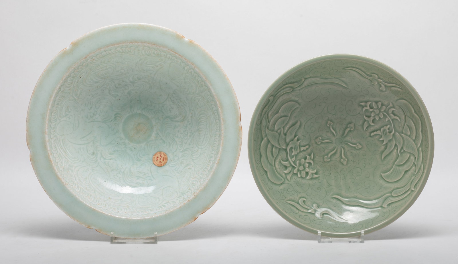 Two Chinese Shipwreck Type Porcelain Bowls: One bowl carved with phoenix and flower, the other carved boys and stylized flowers. Approx. 9.1*2.5 inch (larger).