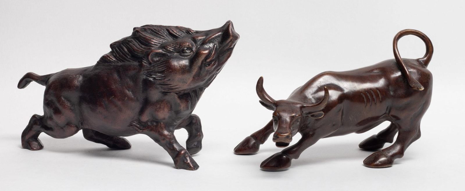 Two Vintage Bronze Table Sculptures: Two table decor bronze sculptures of wild boar and buffalo form. Approx. 8.7*5*2.6 inch (larger).