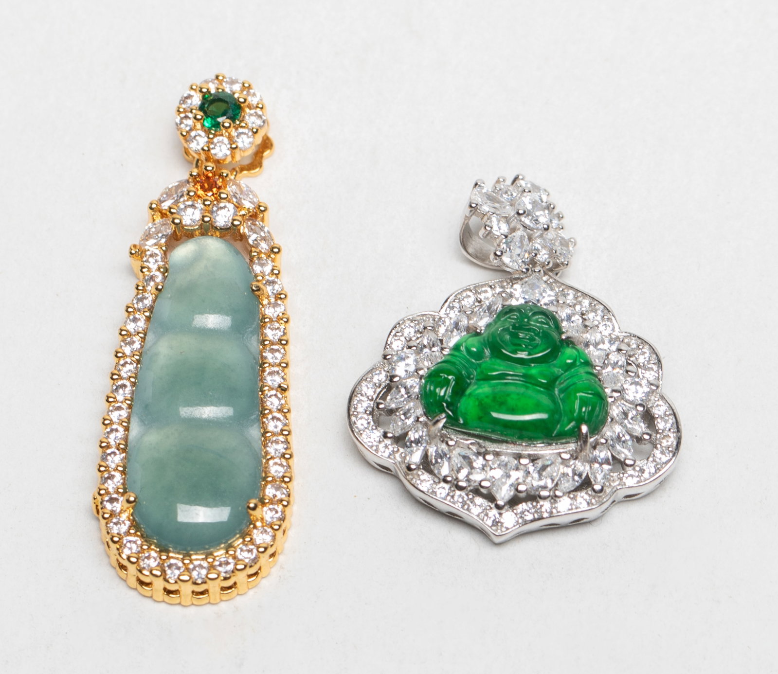 Two Chinese Export Jade Pendants: Two Chinese jade pendants, one carved Buddha, marked S925, the other carved gourd. Approx. 1.45*0.5 inch (larger), 8 gram (total weight).