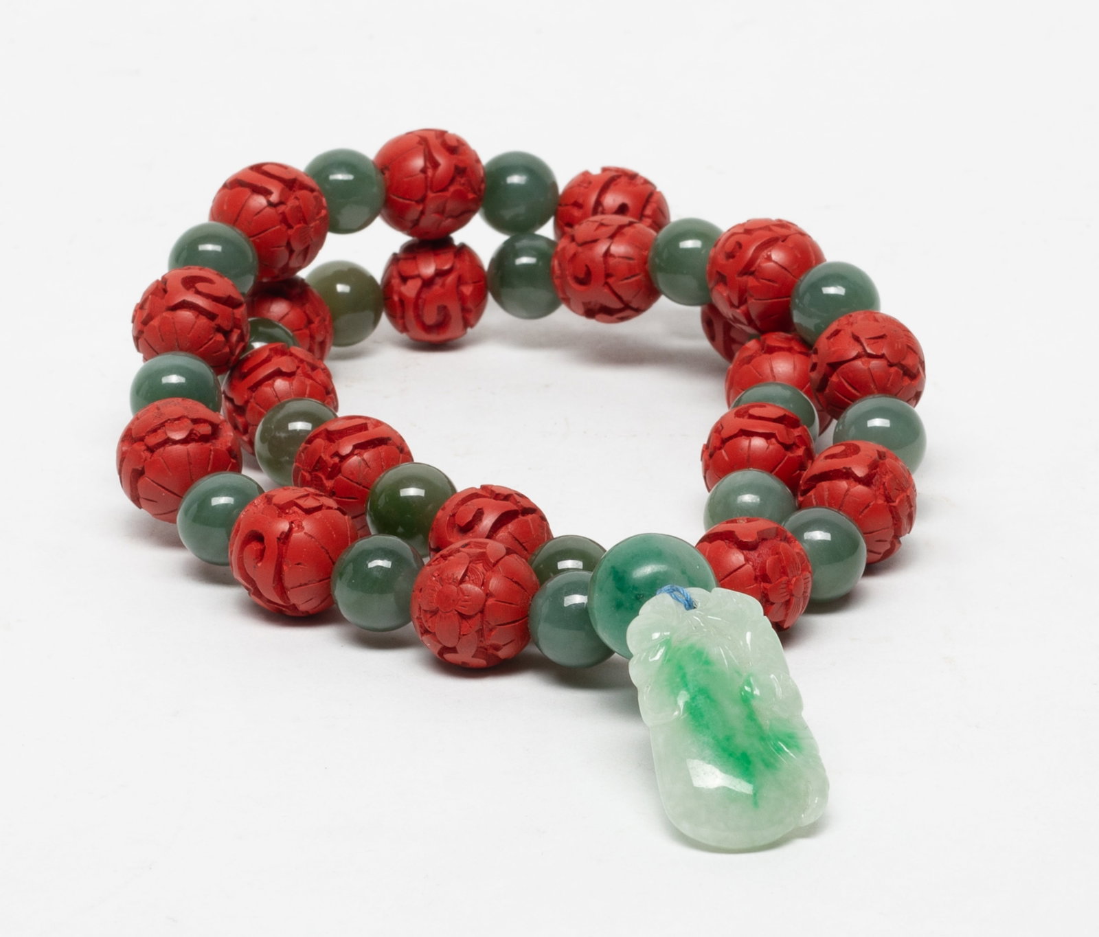 Vintage Chinese Jade, Cinnabar Necklace: Chinese cinnabar and jade bead necklace, with a jade pendant carved bat and gourd. Approx. 22 inch L.