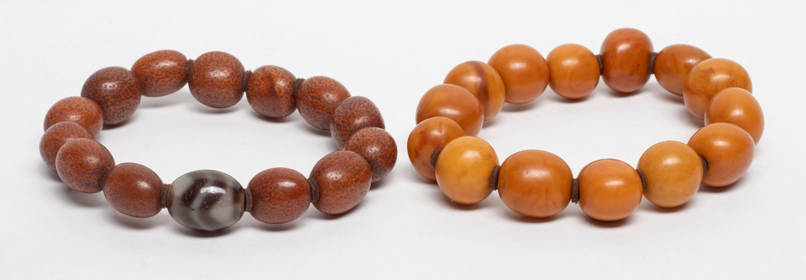 Two Chinese Amber, Dzi Bead Prayer Beads: Two strings of Chinese amber prayer beads and dzi bead. Approx. 70 gram (total bead weight), 0.7*0.6 inch (dzi bead size).