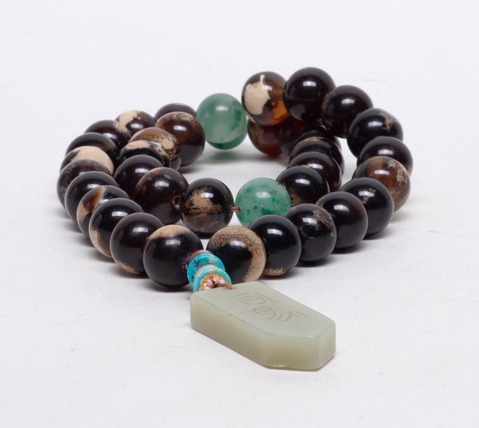 Vtg. Chinese Root Amber Prayer Beads: A string of Chinese root amber and stone carved prayer beads, with a jade pendant. Approx. 122 gram (total weight), 1.85*0.8*0.37 inch (jade pendant size).