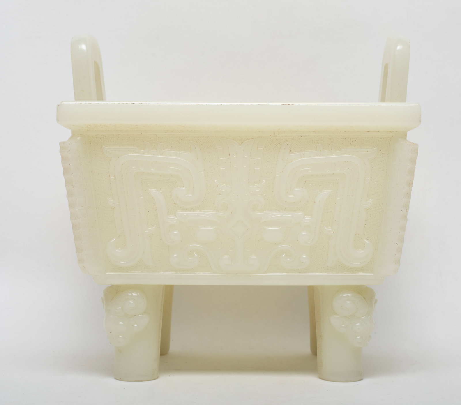 Large Chinese Jade Like Sculpture of Censer: Chinese jade-like censer carved with taotie mask and archaistic beasts on each side. Approx. 6.5*6.5*5.1 inch.