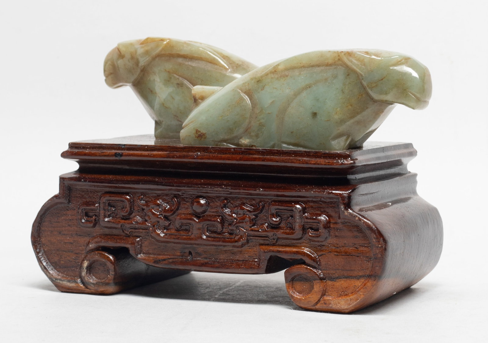 Unusual Chinese Sung Type Jade Beast on Base: Two Chinese russet jade carved crouching beast sculptures, affixed to wood base. Approx. 4.5*6.5*3.3 inch (w/ stand).