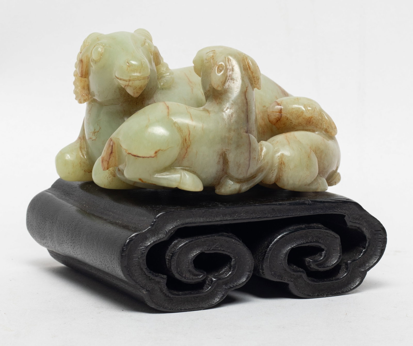 Lg Chinese Jade Carved Sculptures of Ram: Chinese russet jade sculpture carved as three recumbent rams, with wood stand. Approx. 3.73*2.93*2.13 inch (w/o stand).