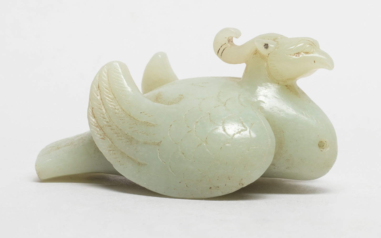 Chinese Cream White Jade Sculpture: Chinese cream white jade carved bird form sculpture. Approx. 2.8*1.8*1.4 inch.