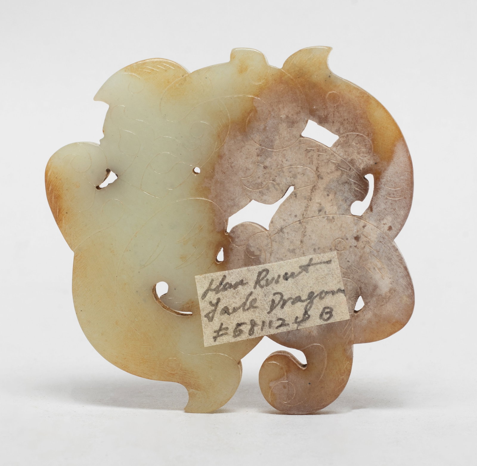 Chinese Russet Jade Pendant: Chinese flat russet jade pendant carved of stylized beast form. Approx. 2.5*2.4 inch.