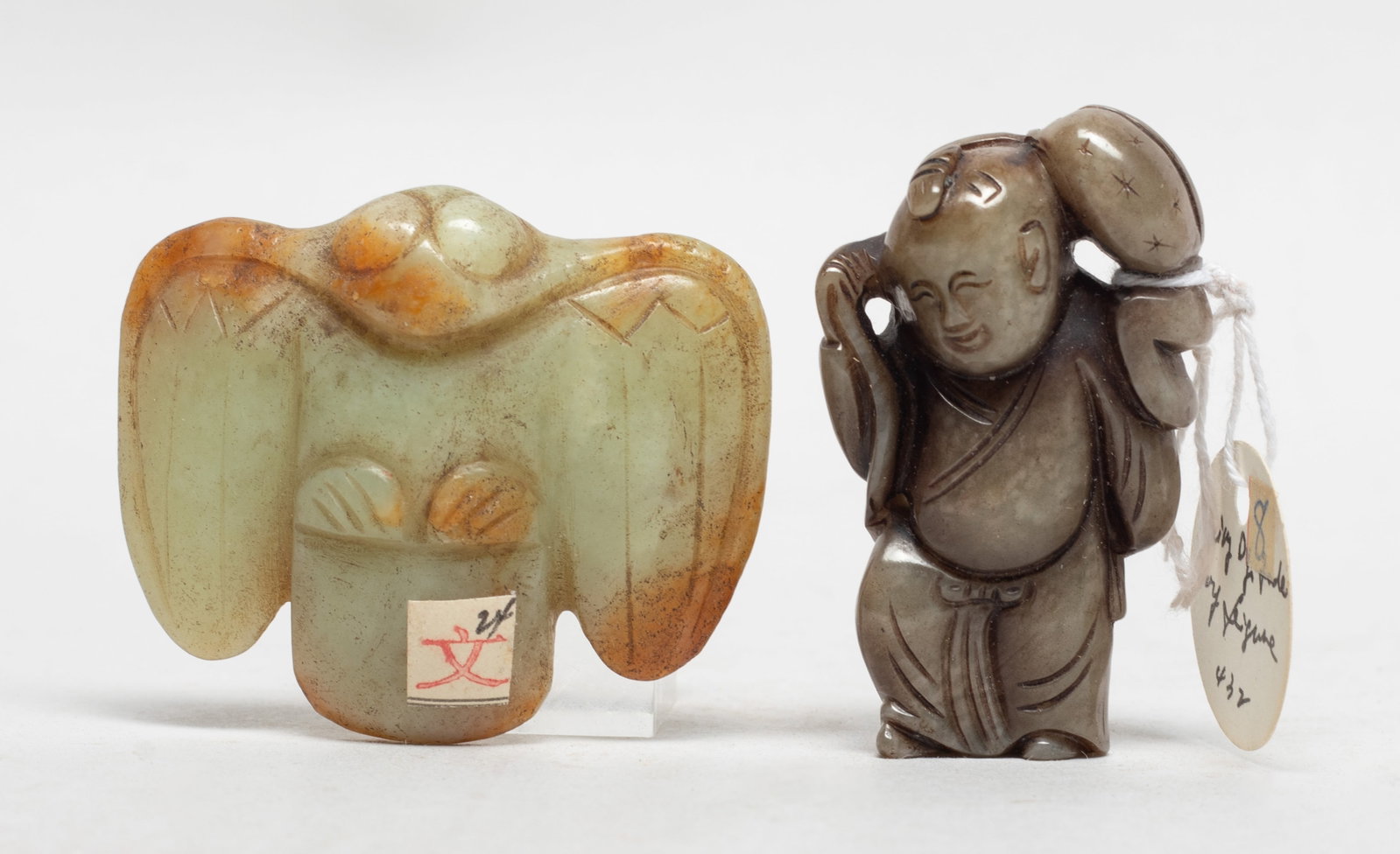 Two Chinese Jade Carved Pendants: Two Chinese jade pendants, one carved of boy form and the other of stylized bird form. Approx. 2.2*1.85*0.6 (bird size).